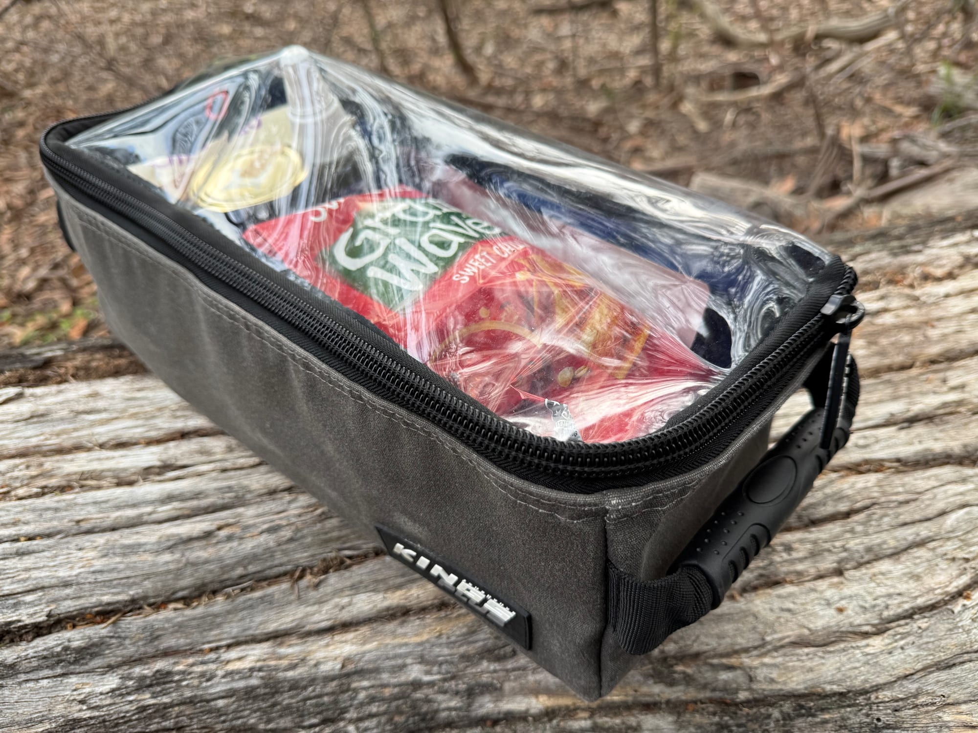 A packed Kings Plus clear top bag, showing the contents through the clear lid