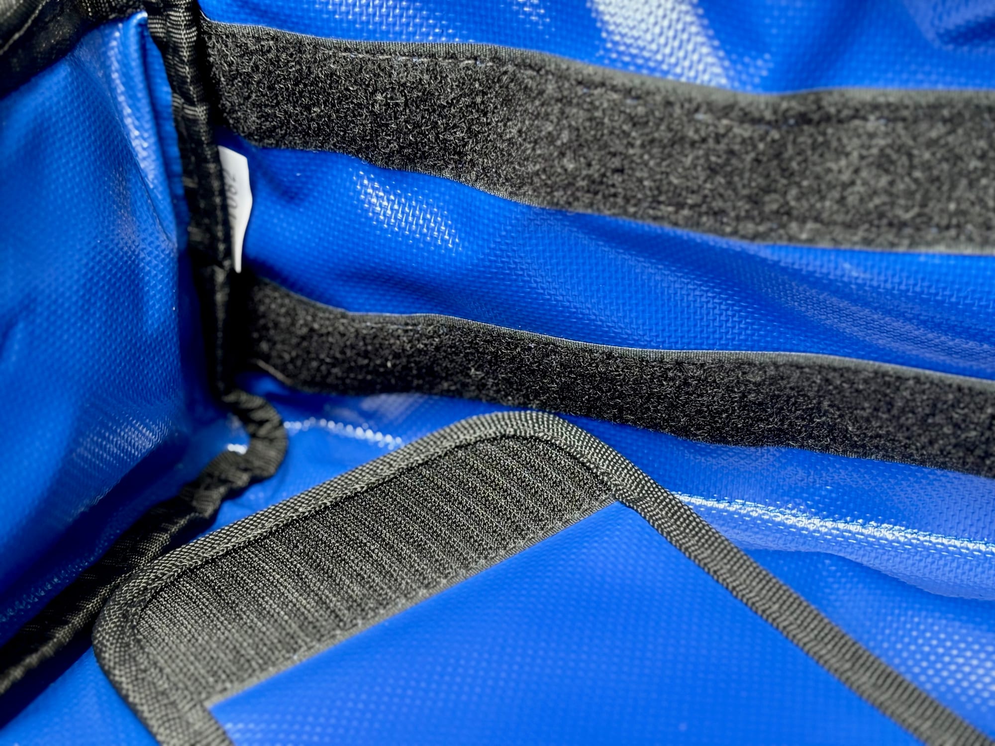 The Velcro strips on the blue PVC lining where the Kings Plus divider attaches