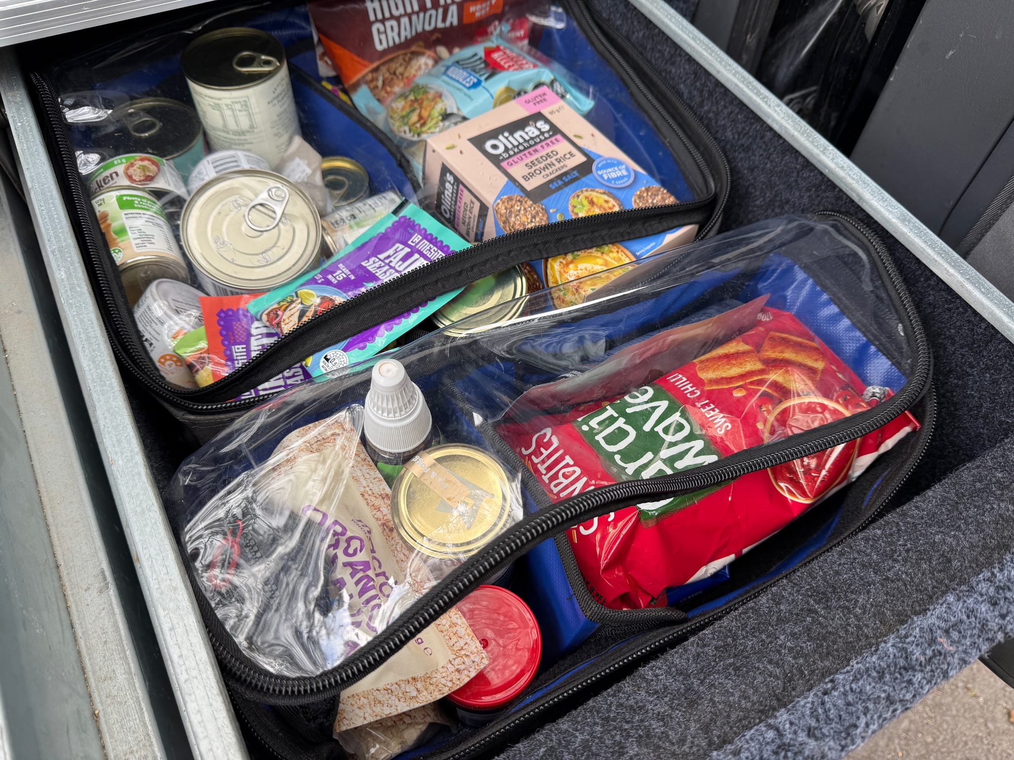 A Kings Plus clear top bag packed with food in our Titan drawer, beside another one
