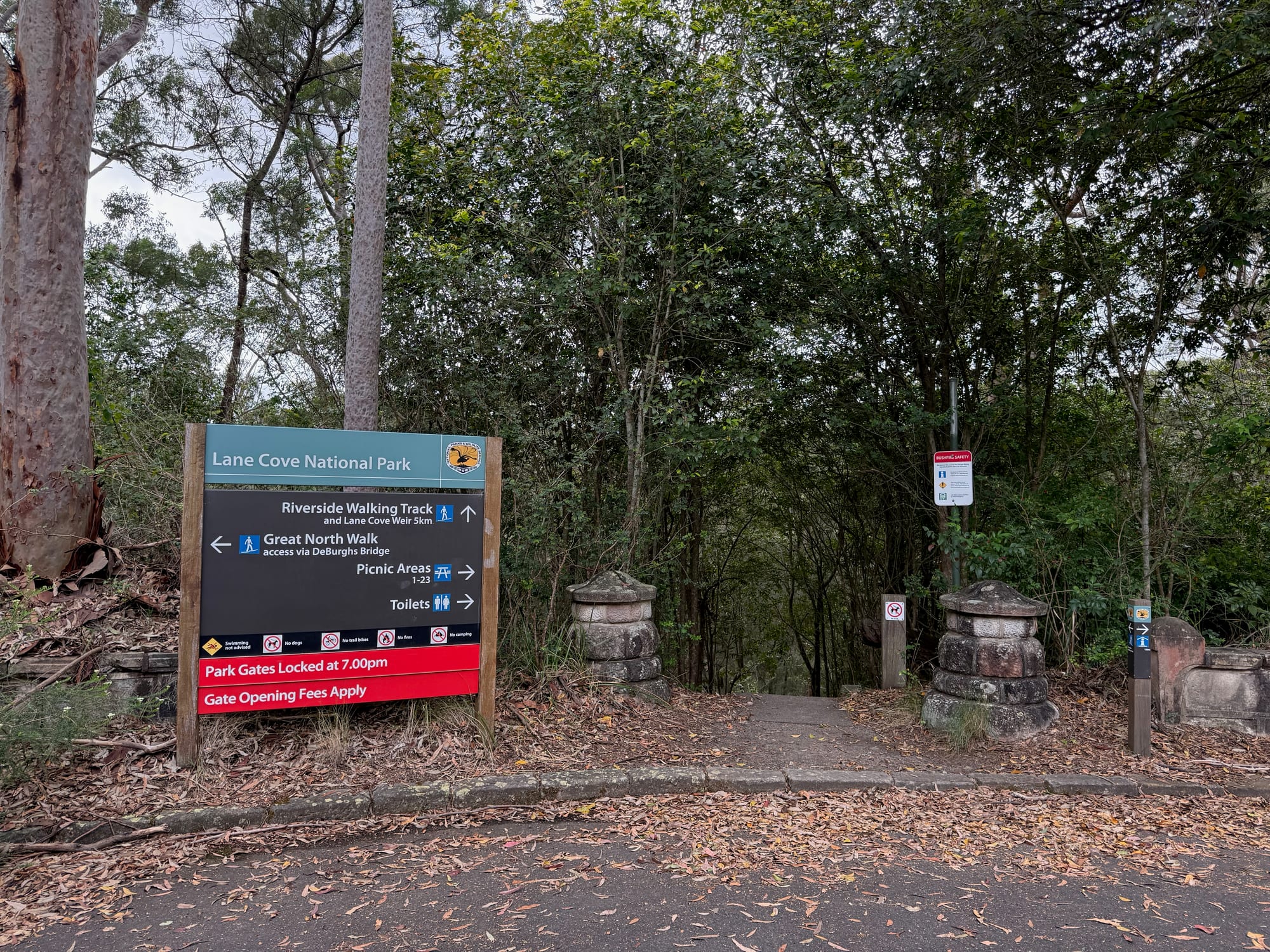 The Lane Cove National Park sign pointing to the Riverside Walking Track, the Great North Walk, the picnic areas and toilets