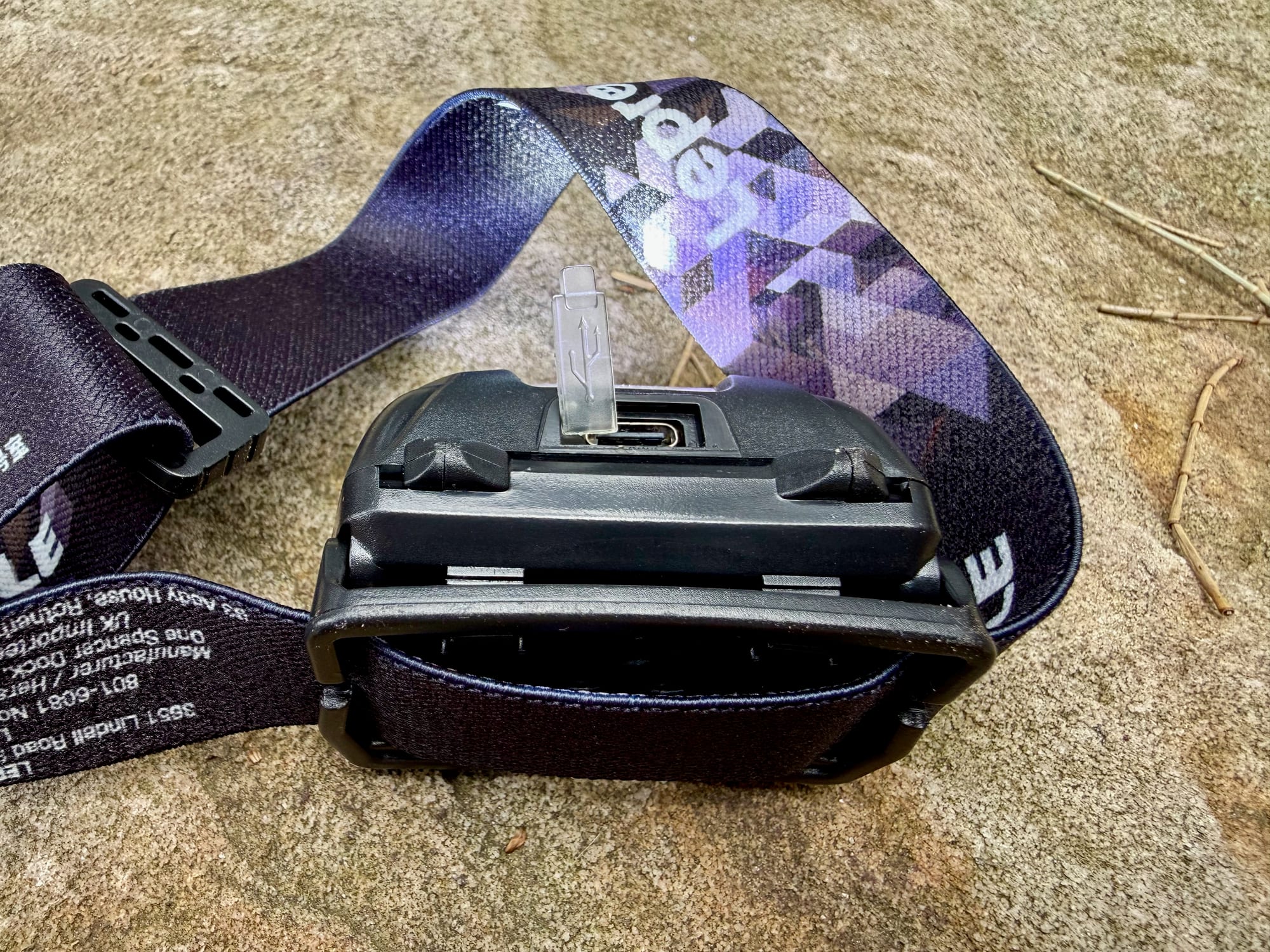 The charging port on the back of the Lepro 3200008 headlamp