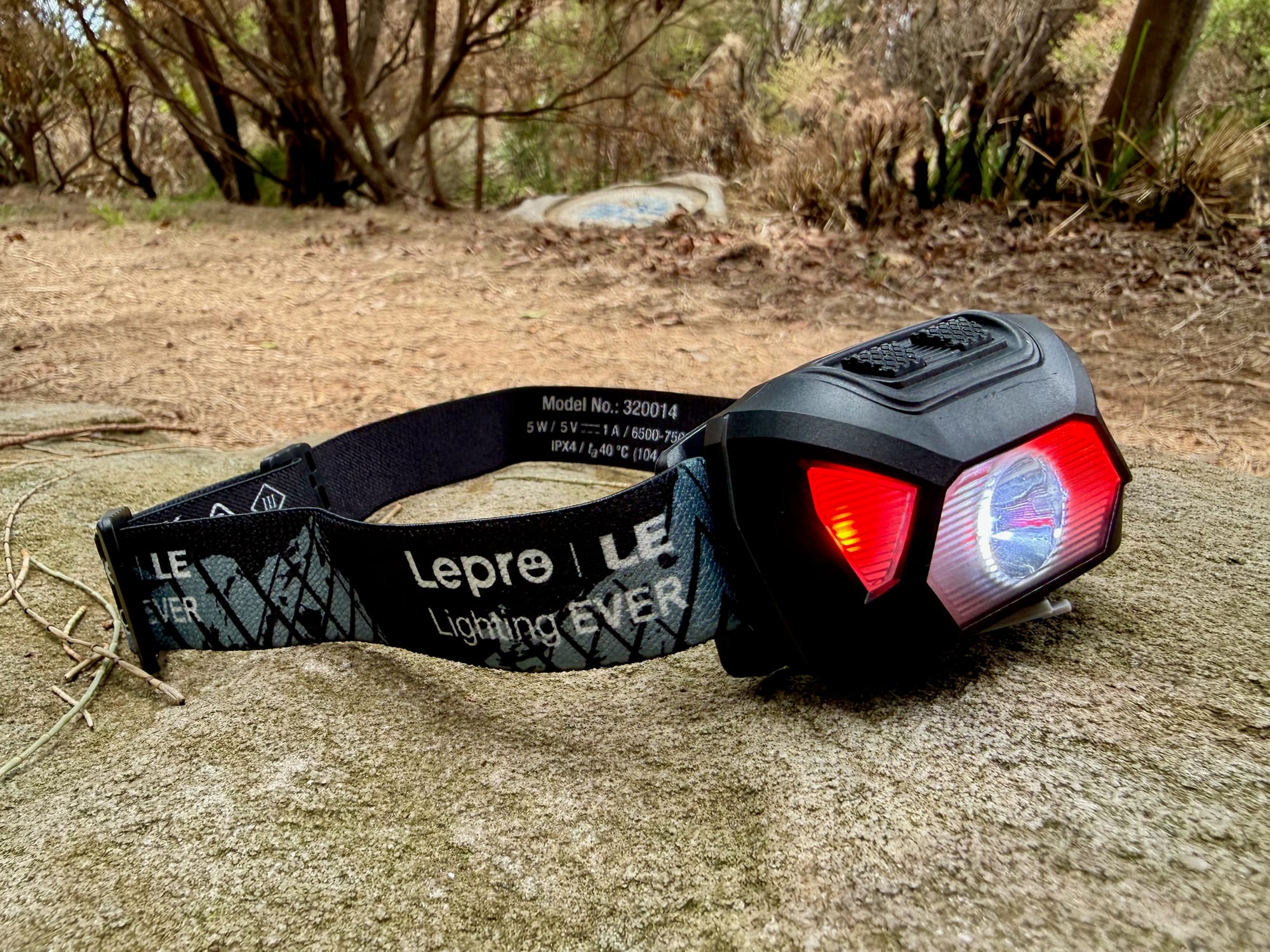 The red light of the Lepro 320014 headlamp switched on