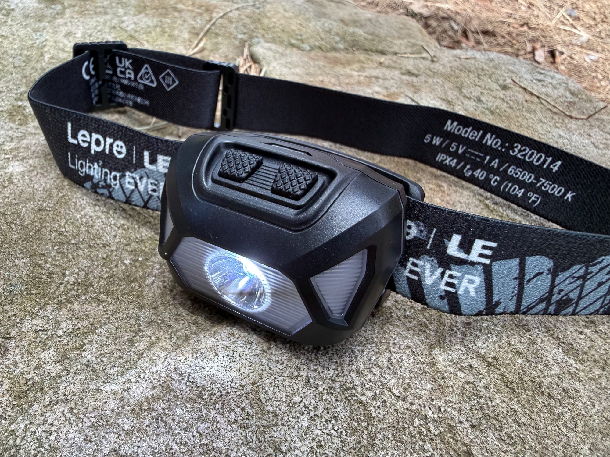 The two buttons on top of the Lepro 320014 headlamp
