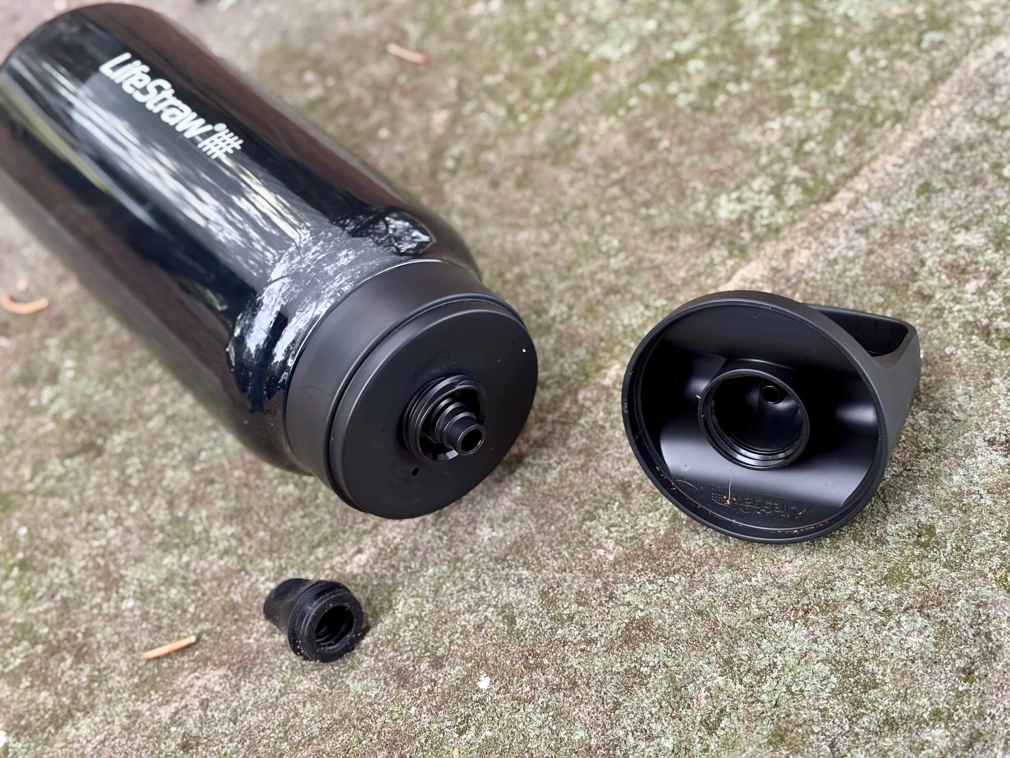 The LifeStraw Go with the cap unscrewed and the soft mouthpiece pulled off for cleaning