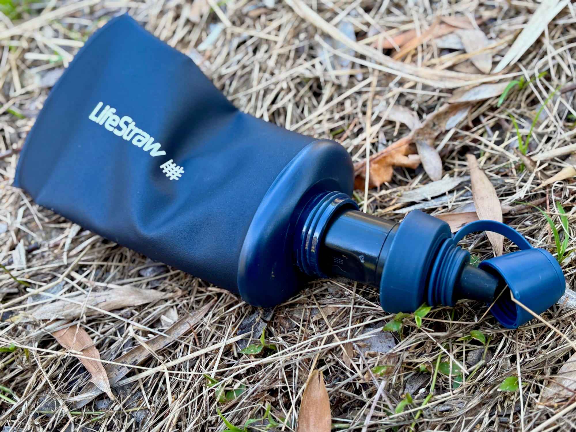 The filter of the LifeStraw Peak Squeeze screwed onto the outside of the bottle