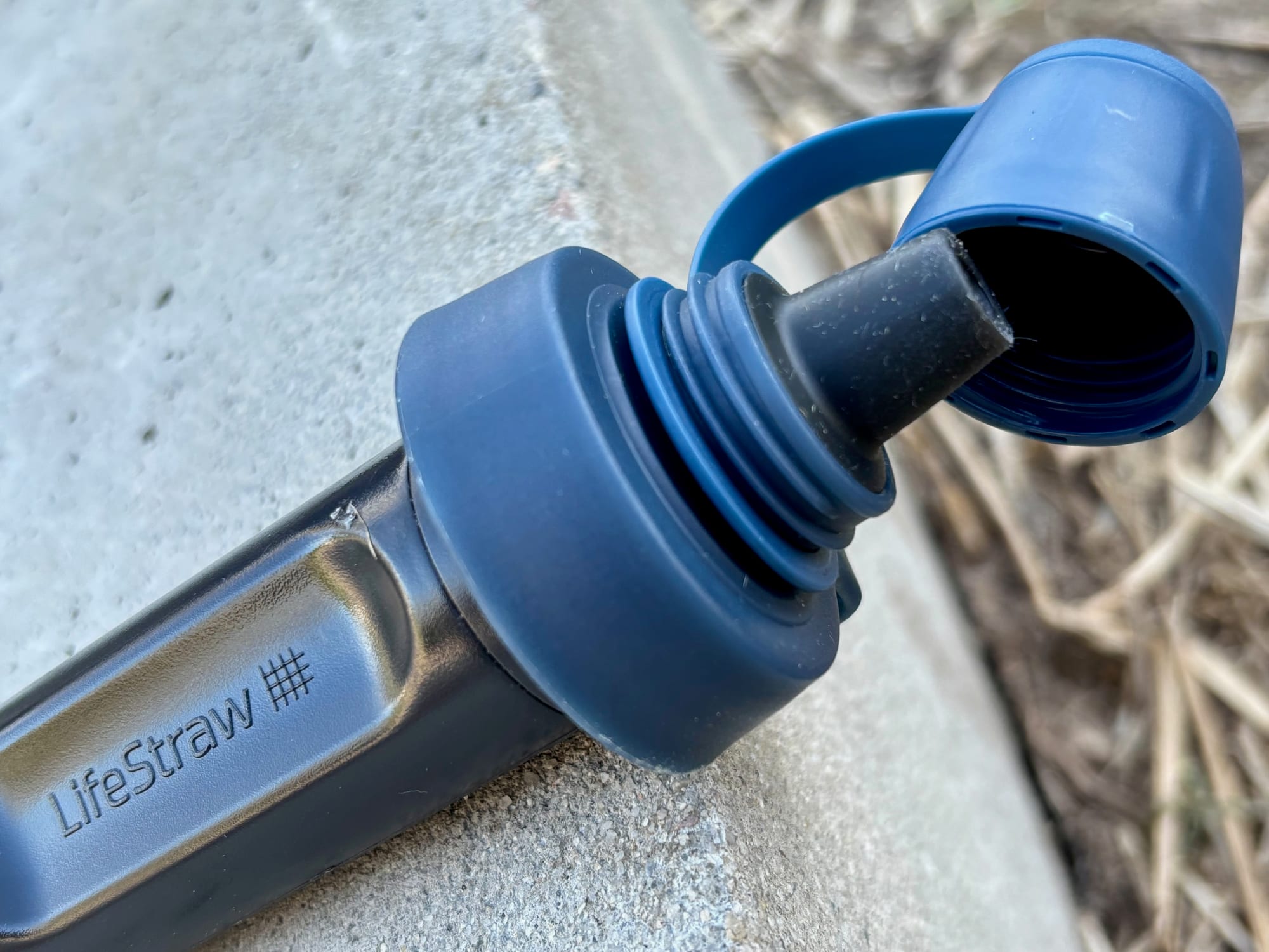 The soft mouthpiece of the LifeStraw Peak Squeeze with its cap flipped open