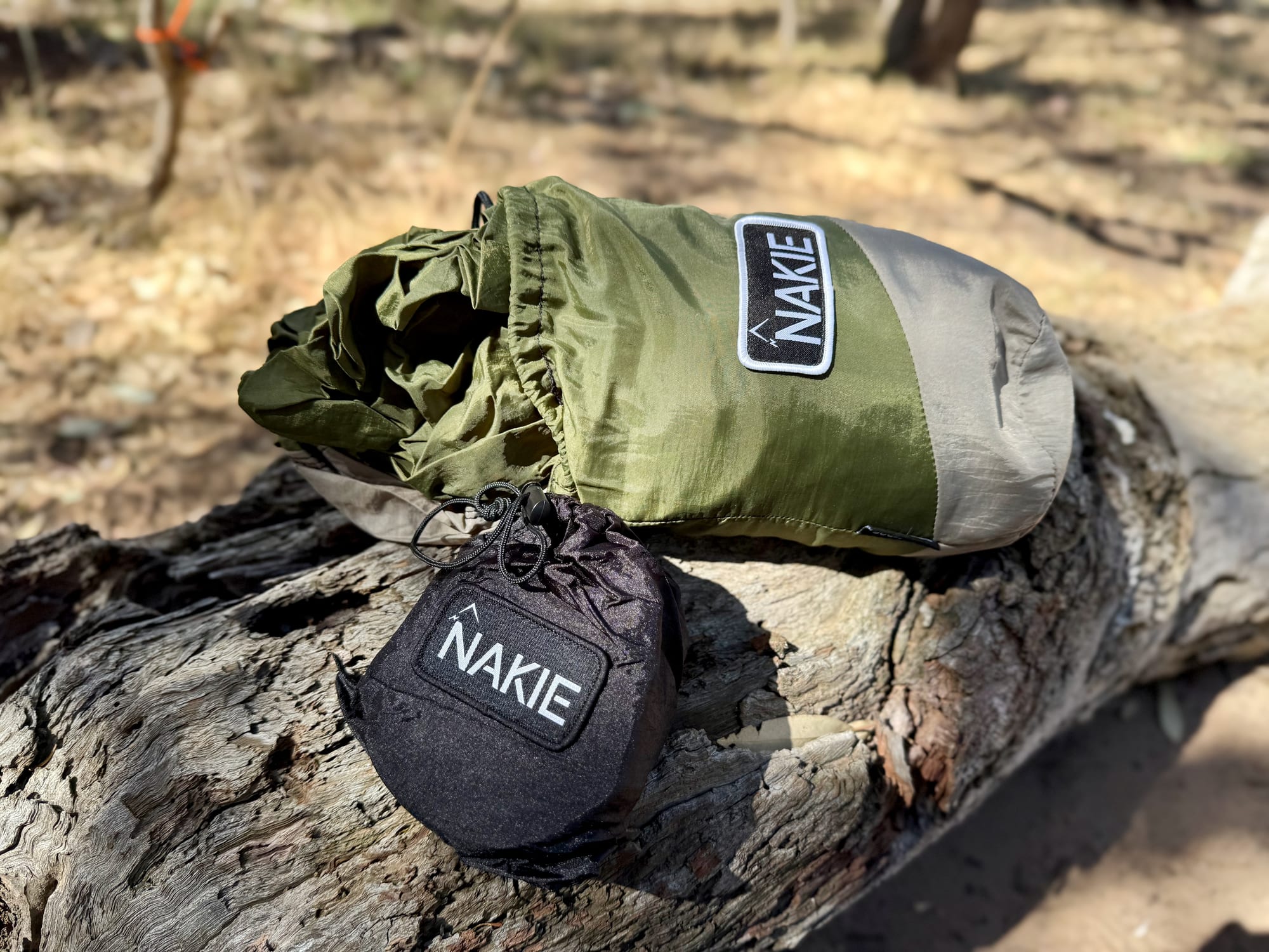 The Nakie hammock in its stuff sack next to the small black bag for the straps
