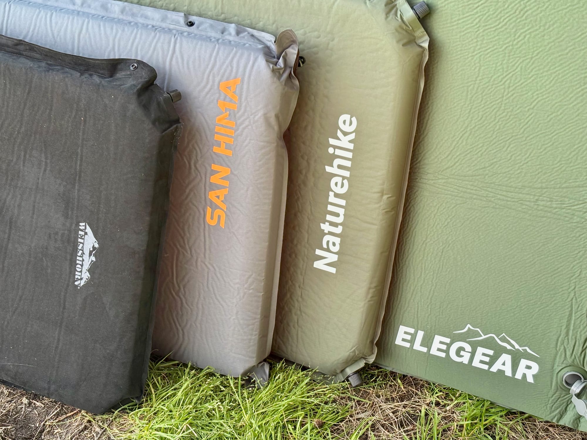 The Weisshorn, San Hima, Naturehike and Elegear self-inflating mats standing side by side