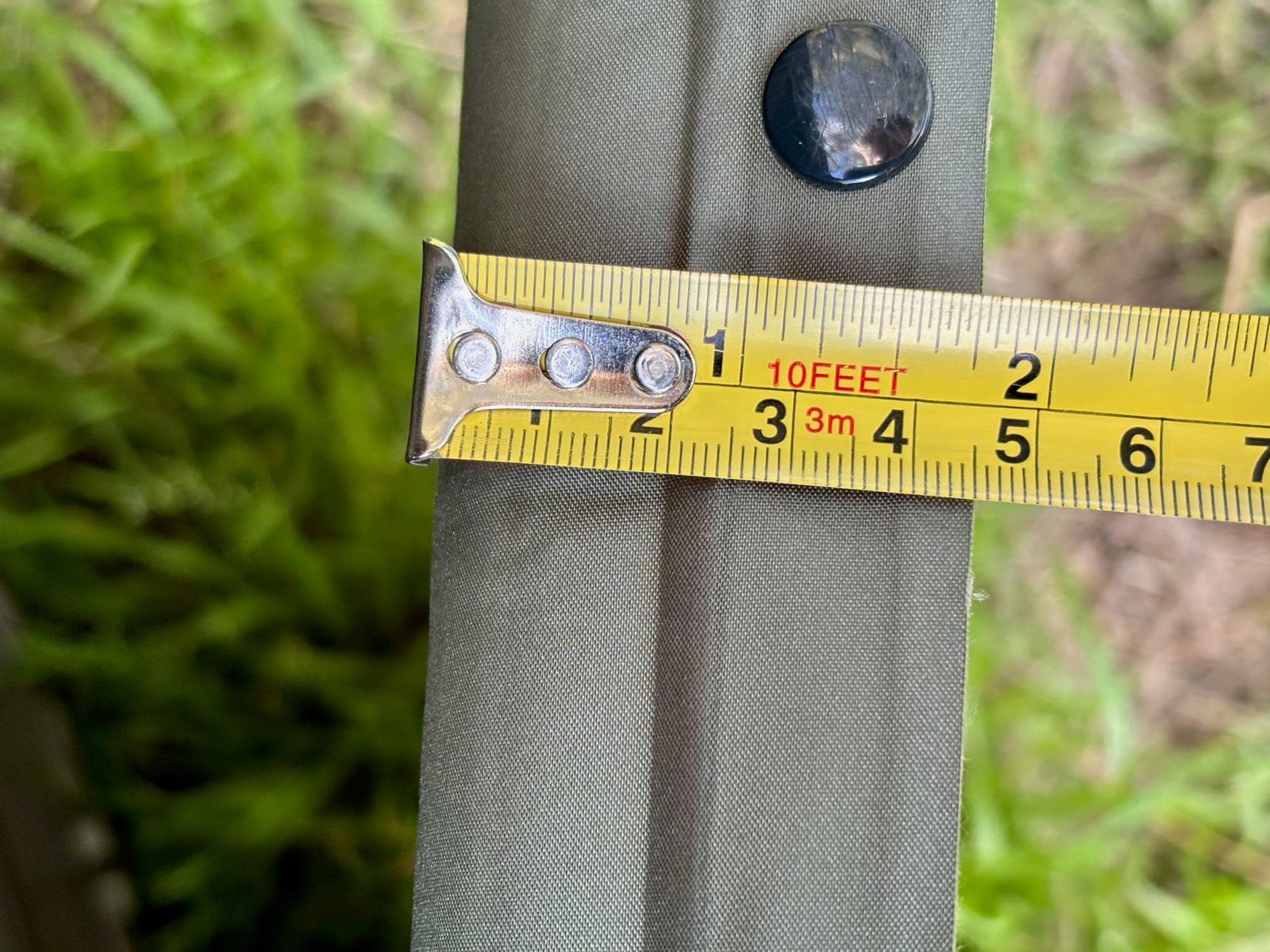A tape measure across the edge of the Naturehike D-Series sleeping pad