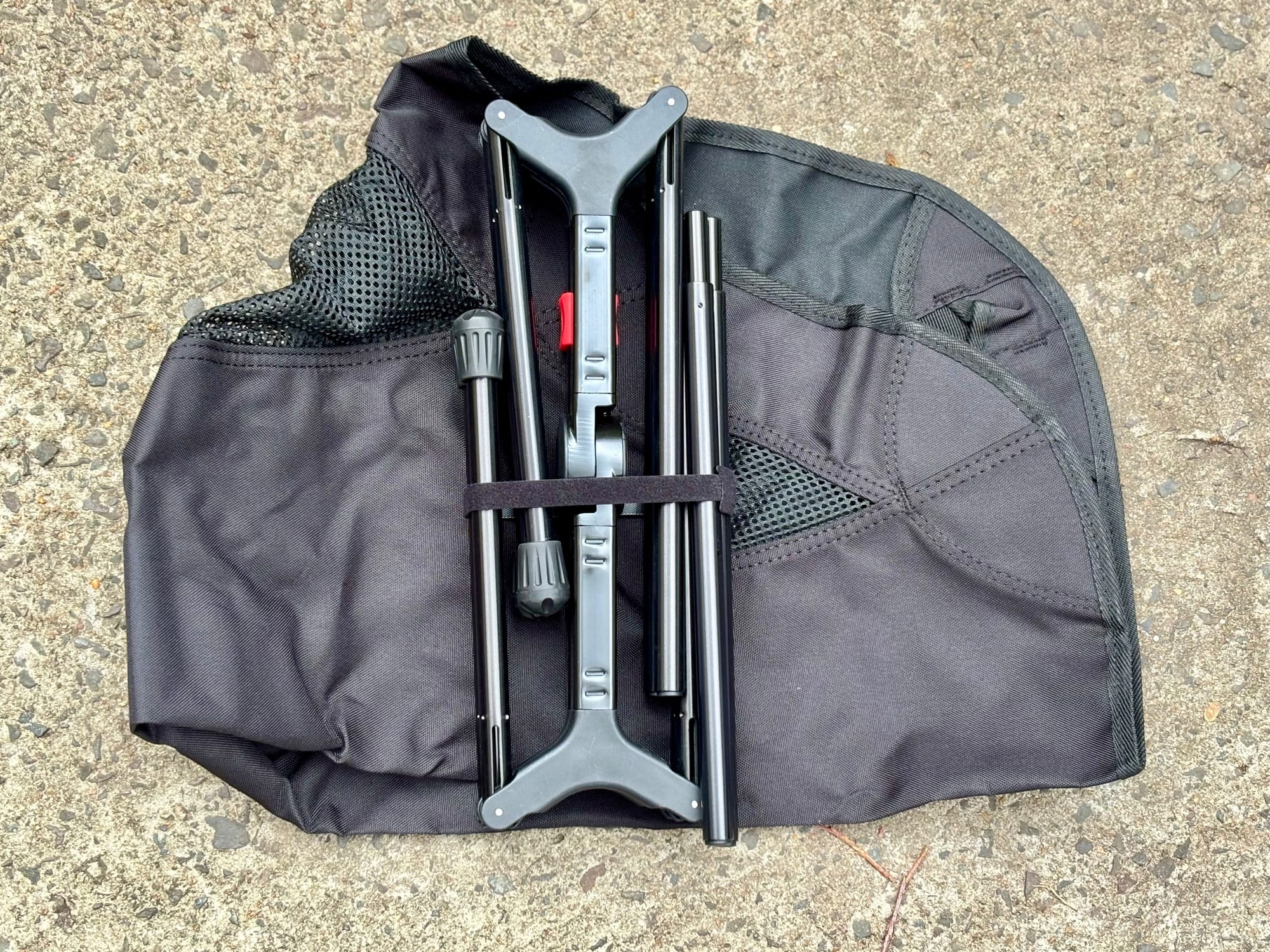 The folded YL01 frame strapped together on top of the seat fabric