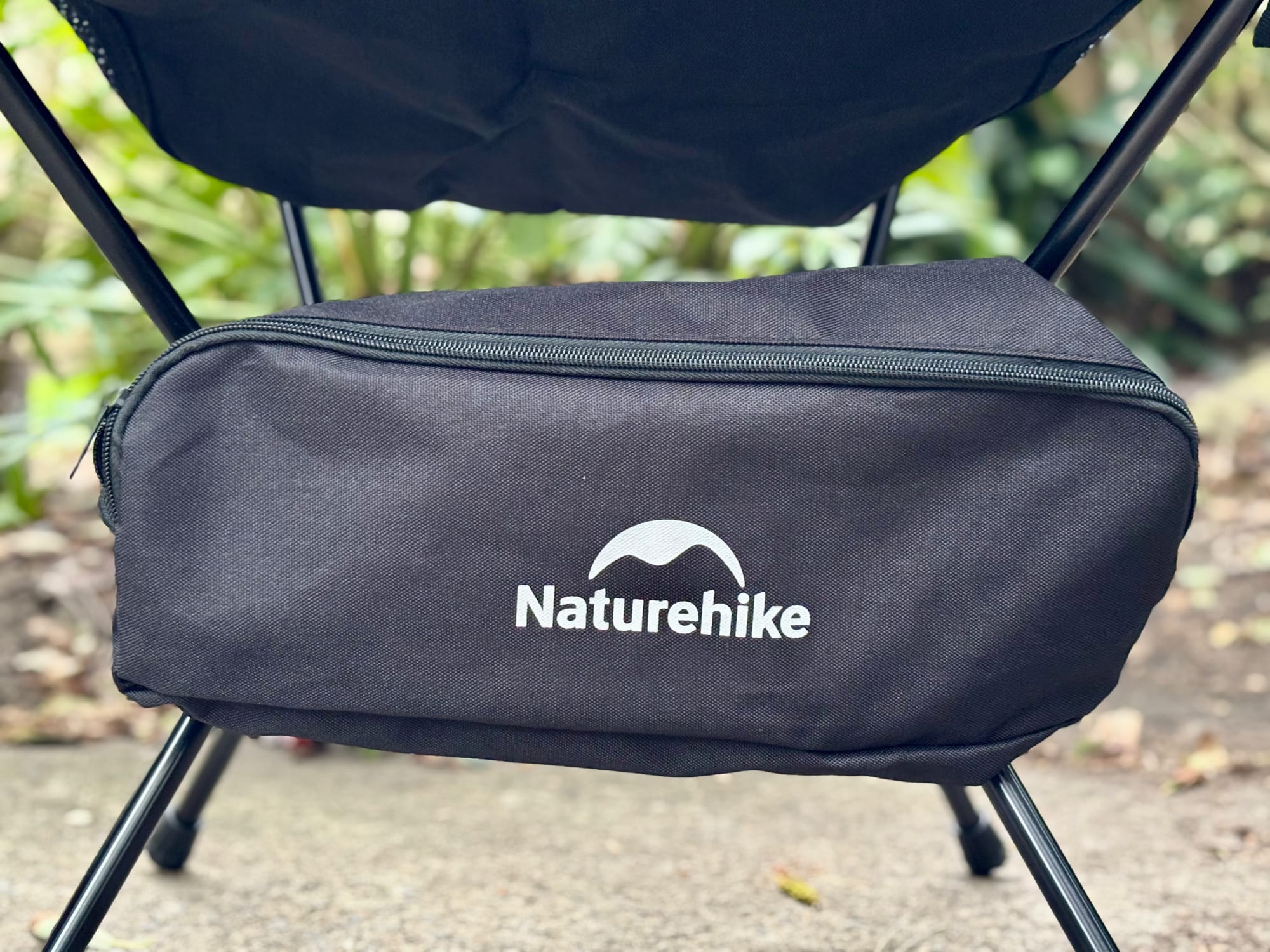 The black carry bag attached to the frame under the seat of the Naturehike YL01