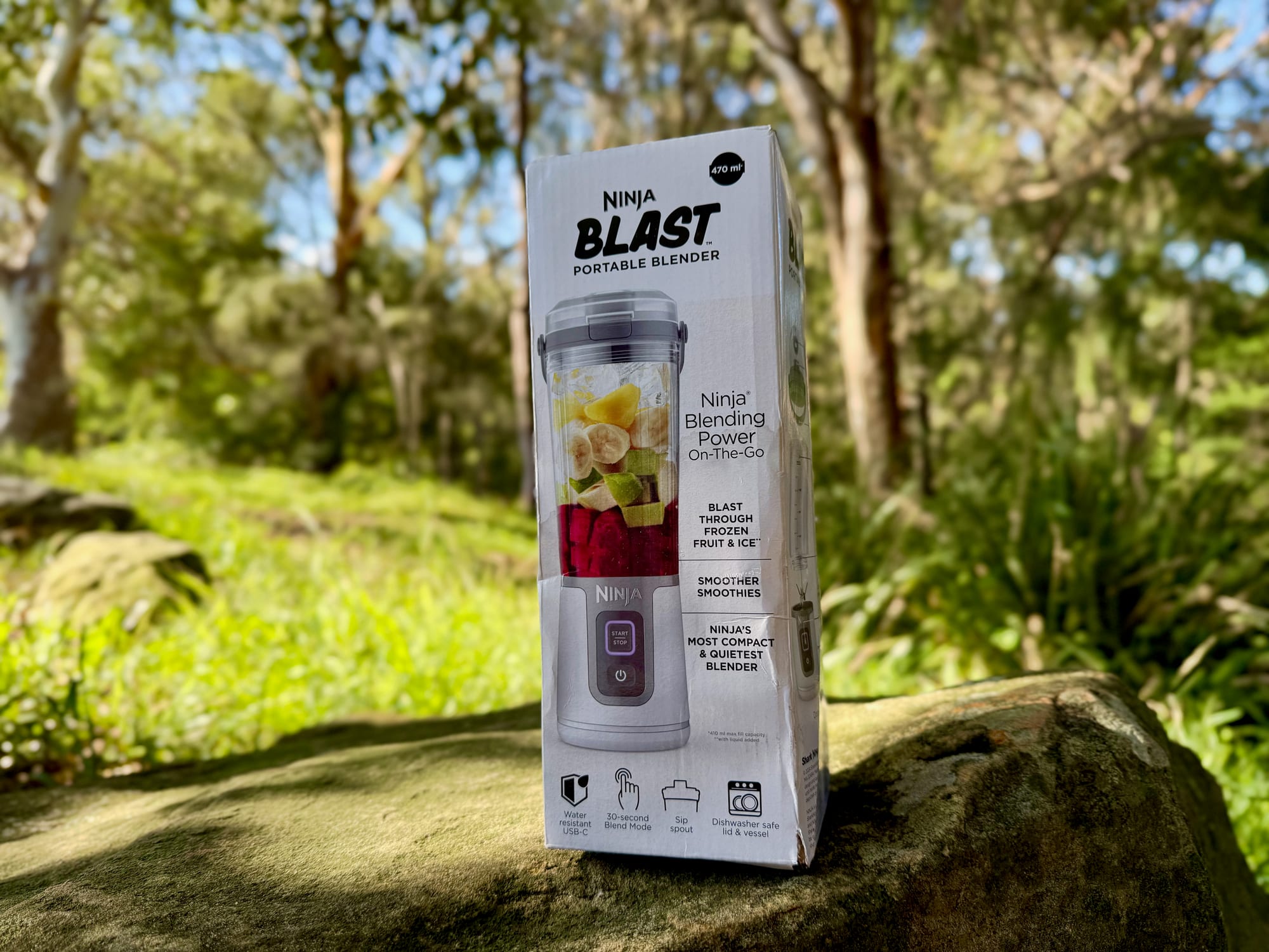 The Ninja Blast portable blender box on a rock in the bush