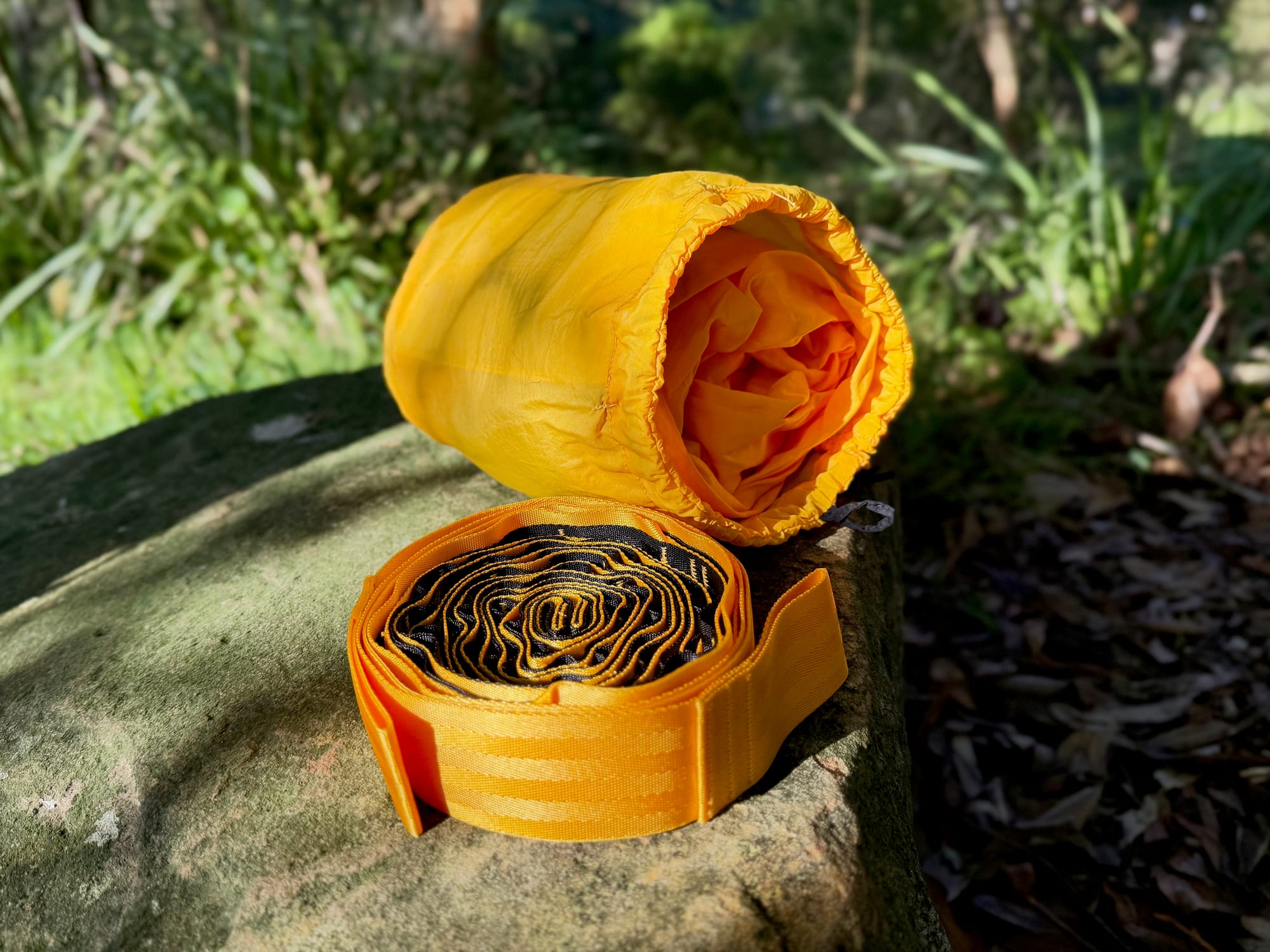 The open stuff sack of the Wawona hammock with the coiled tree straps inside