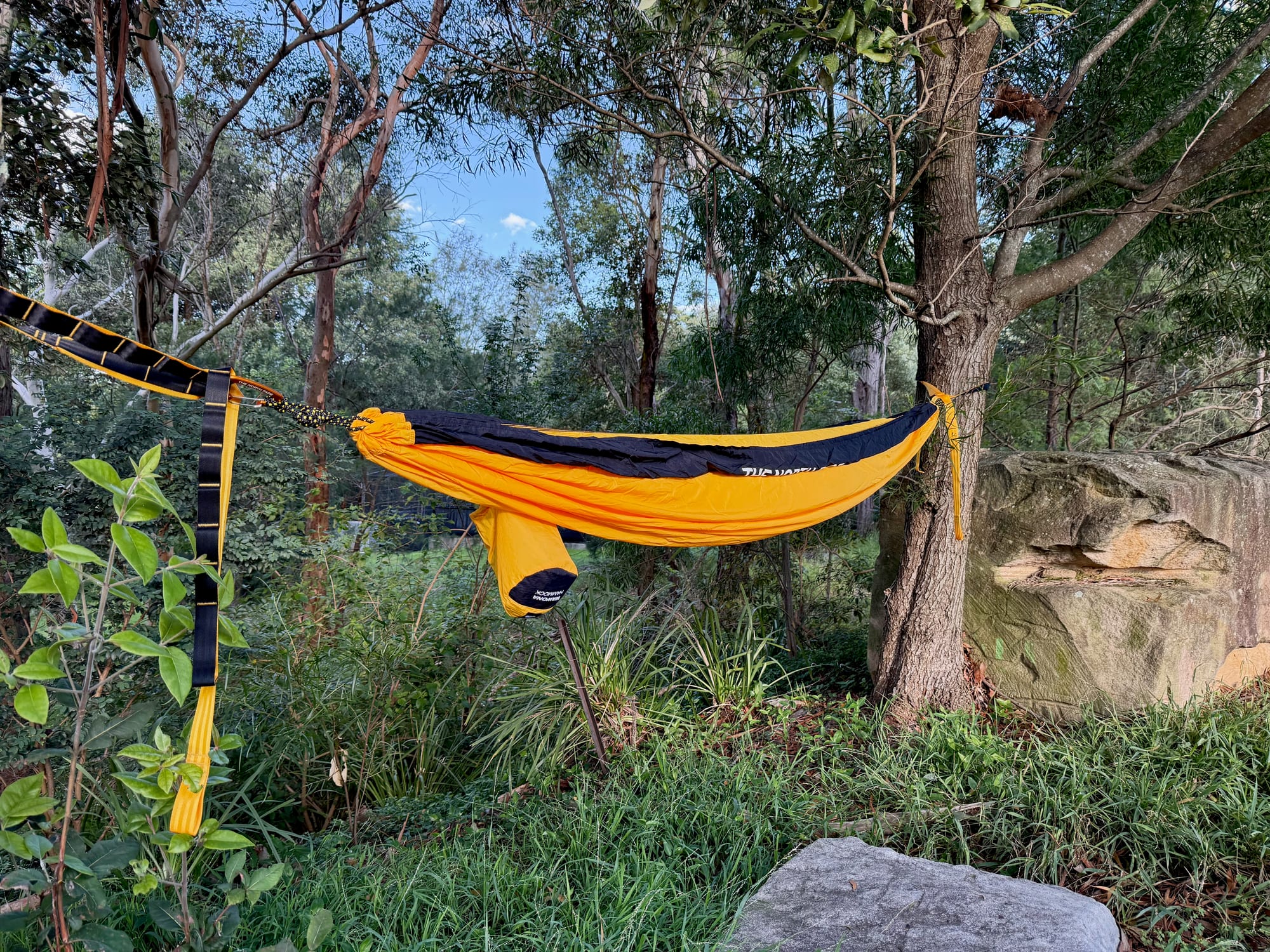 The North Face Wawona hammock hung between two trees in the bush