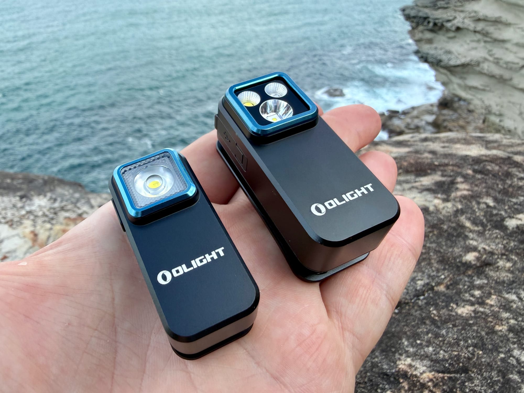 The Olight Oclip and the Oclip Pro in one hand