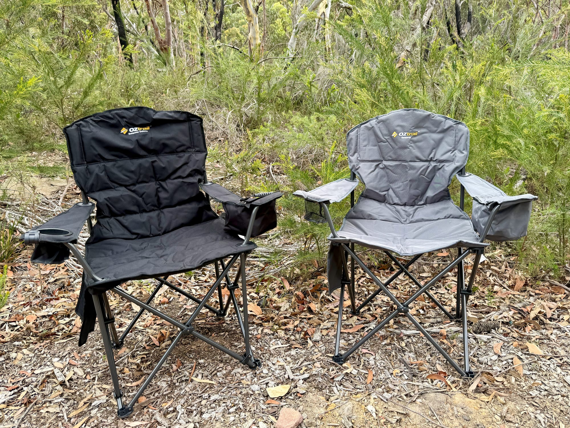 The Getaway Chair in grey next to the Getaway Deluxe in black