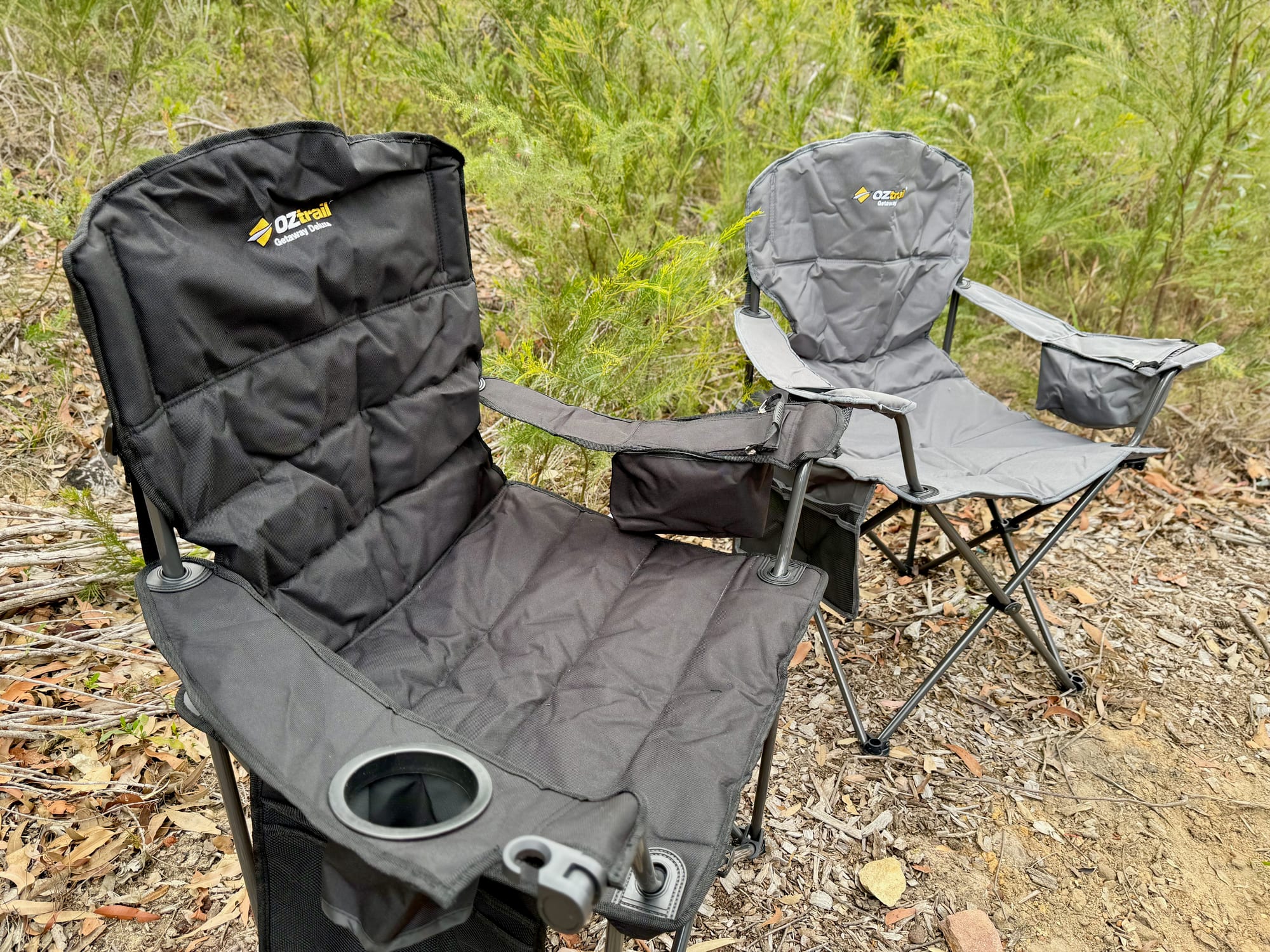The Getaway Deluxe in black next to the Getaway Chair in grey