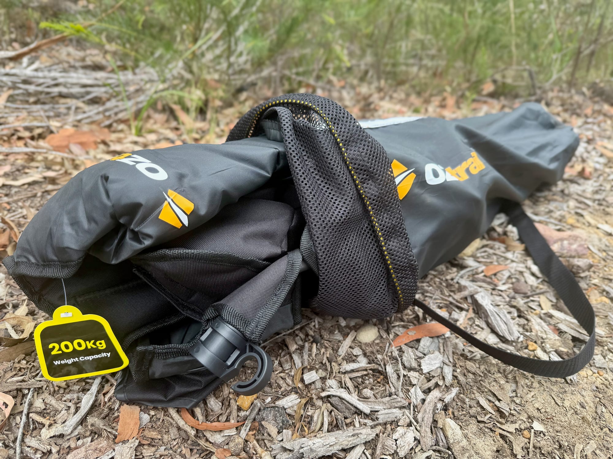 The OZtrail Getaway Deluxe Chair packed in its carry bag