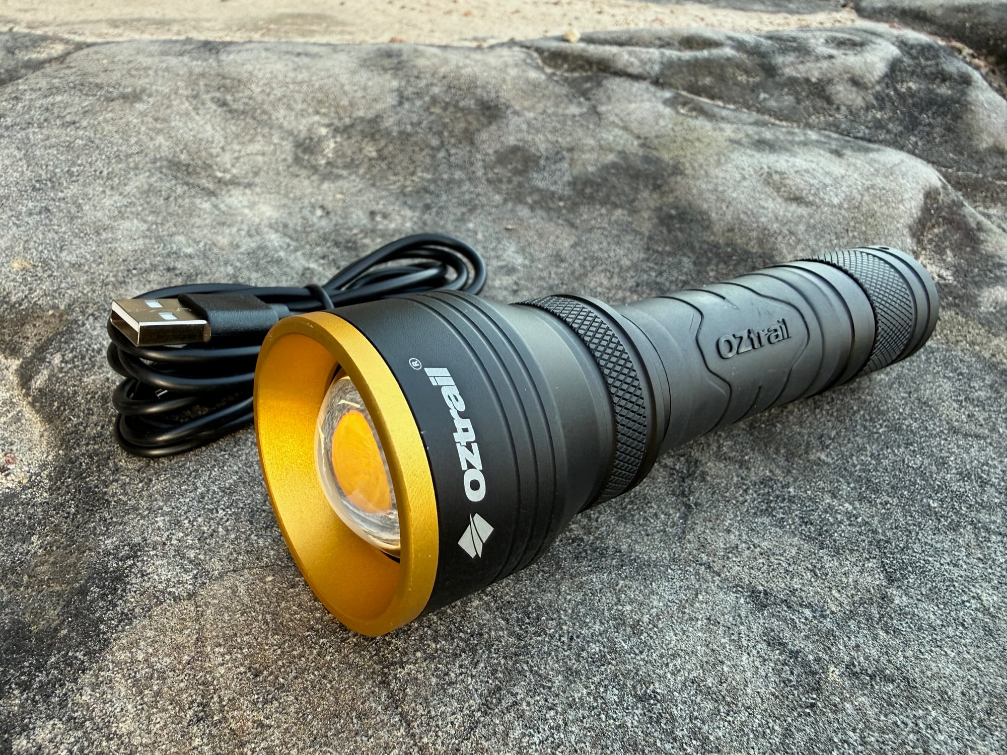 Close-up of the FR800’s gold bezel and lens