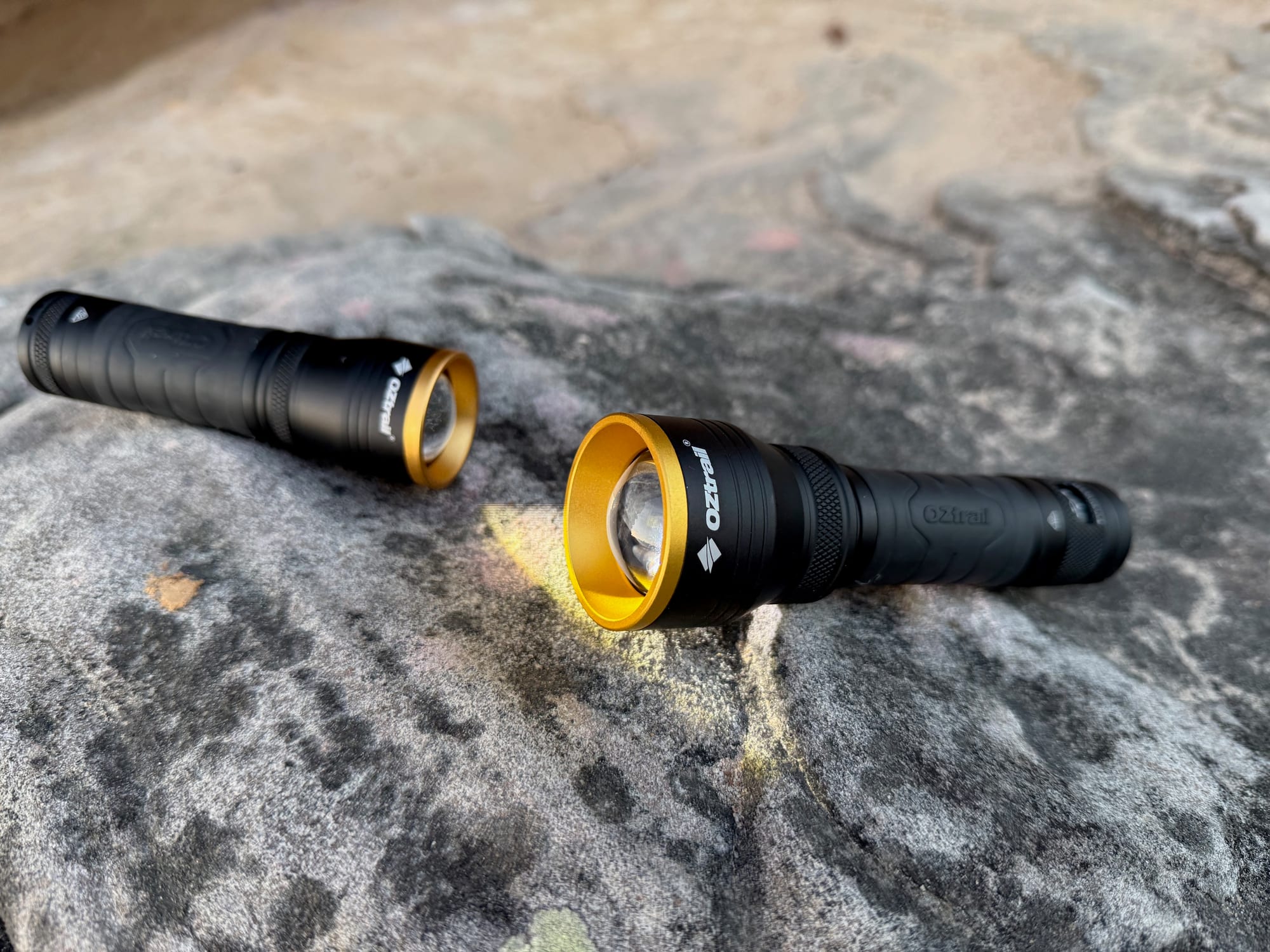 The OZtrail Lumos FR800 and the smaller F300 side by side on a sandstone rock