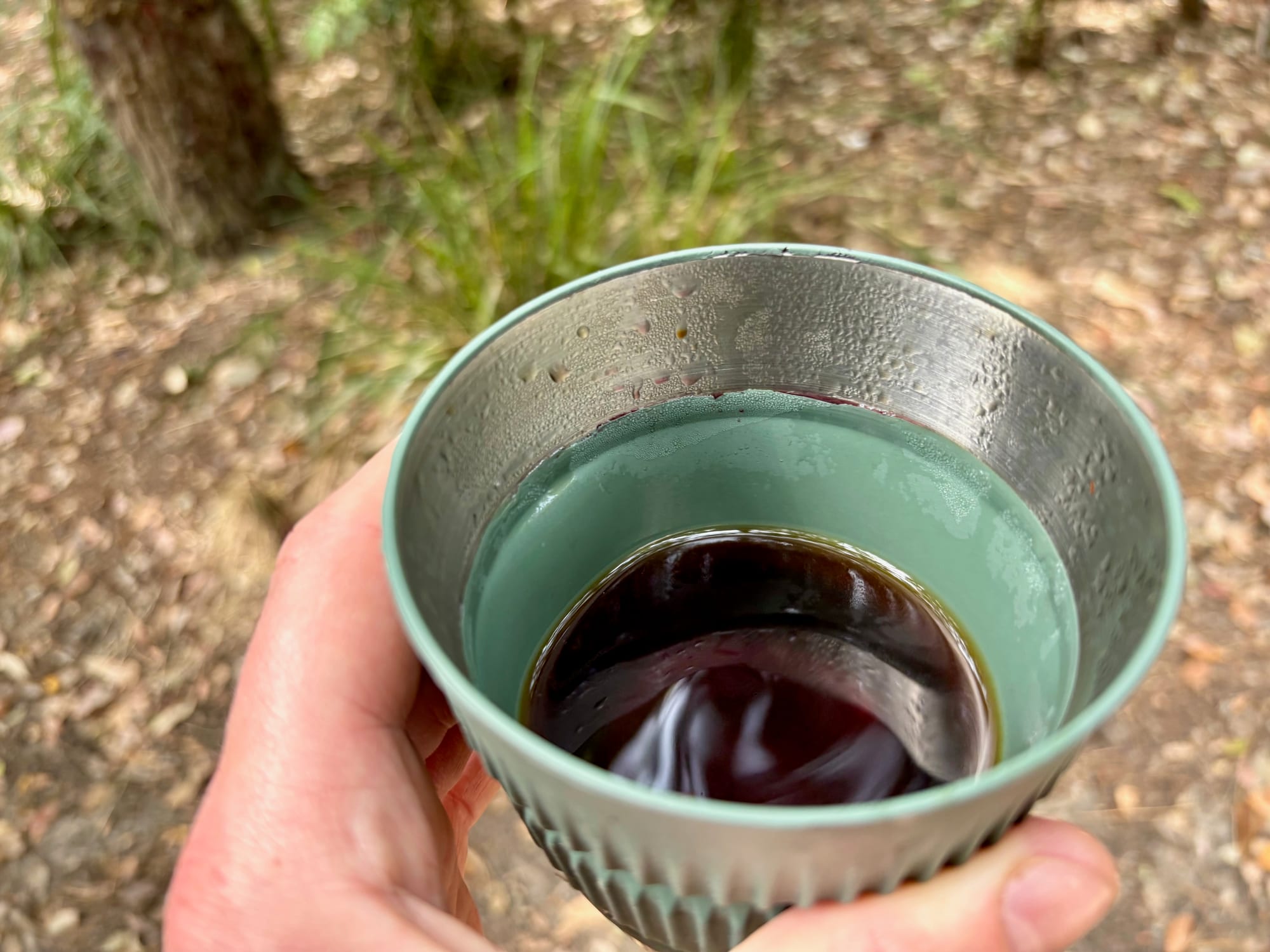 The finished black coffee in the mug