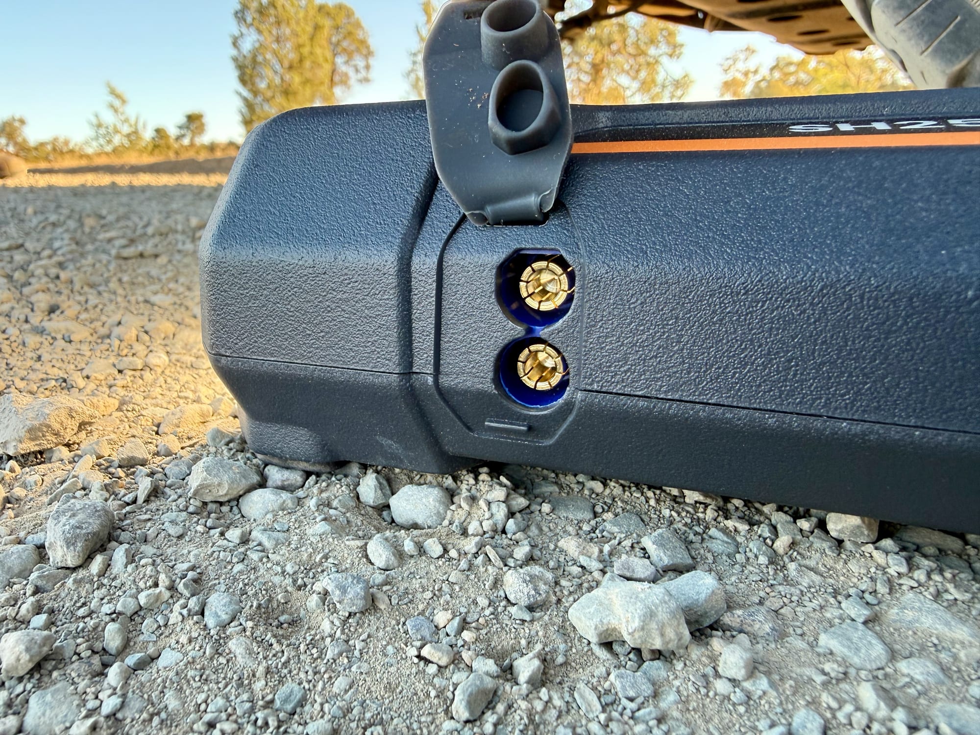 The jump starter port on the side of the San Hima under its rubber flap