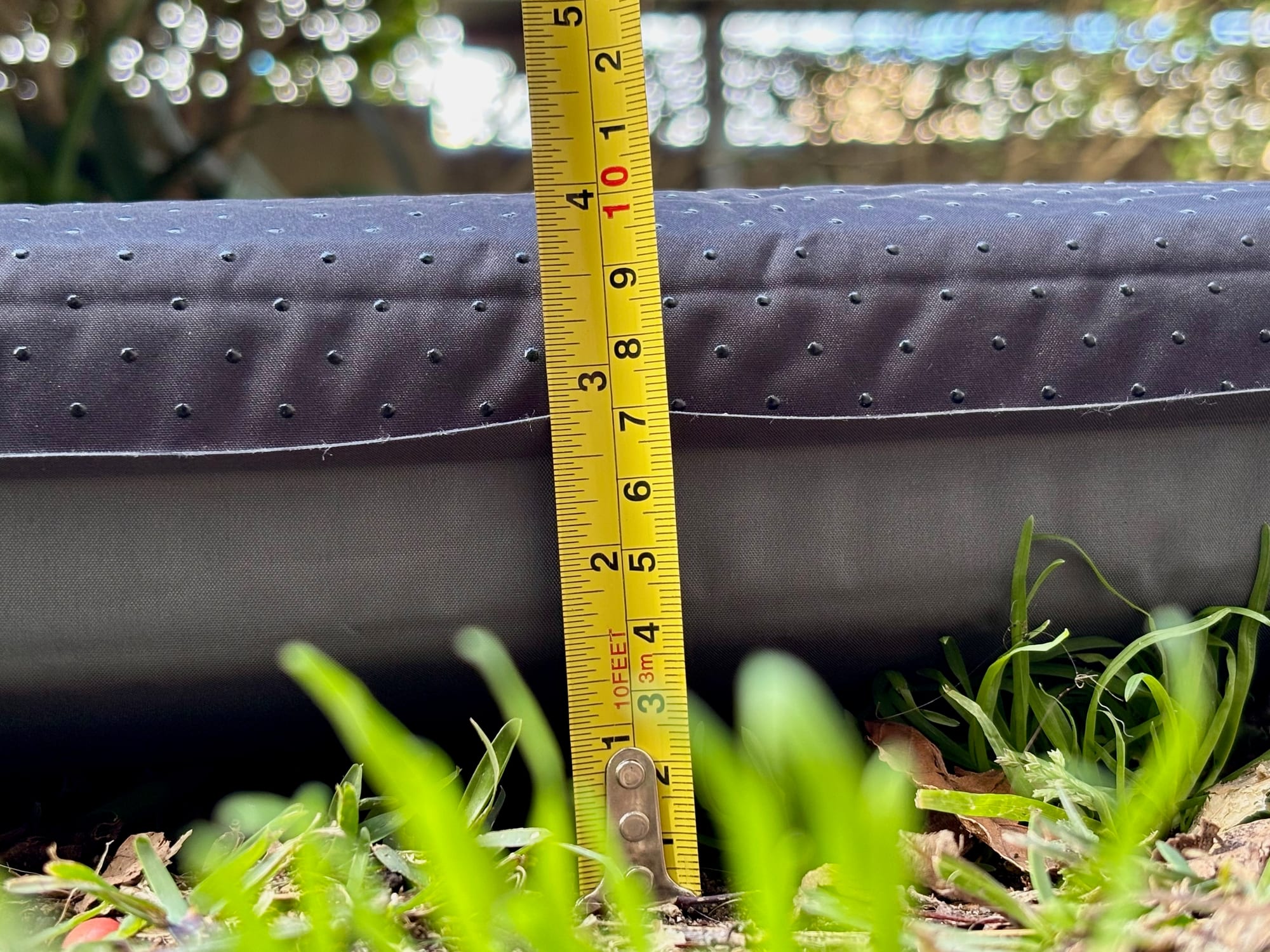 A tape measure against the side of the San Hima self-inflating mattress showing about 10 cm