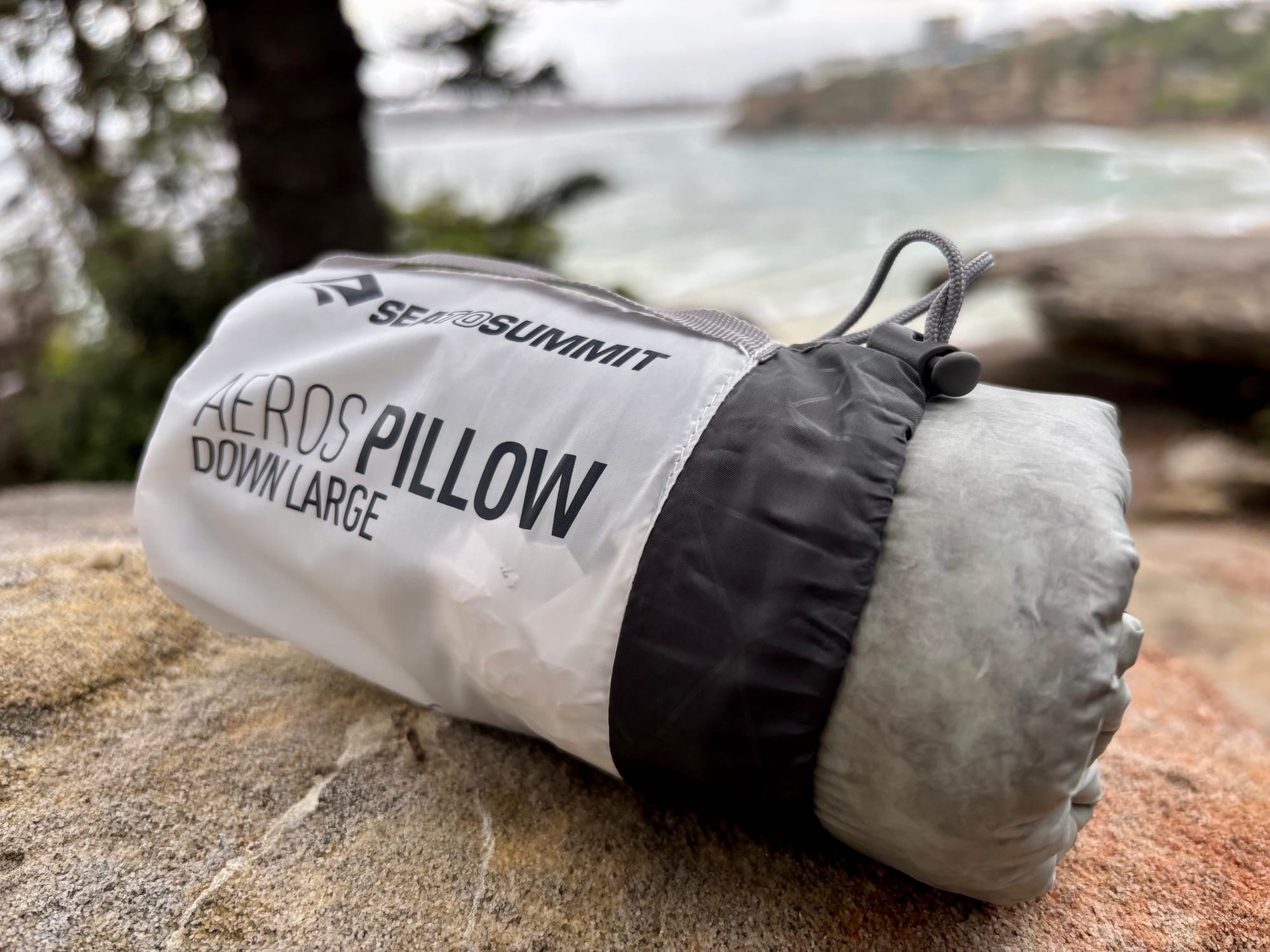 The Sea to Summit Aeros Down Pillow packed in its stuff sack