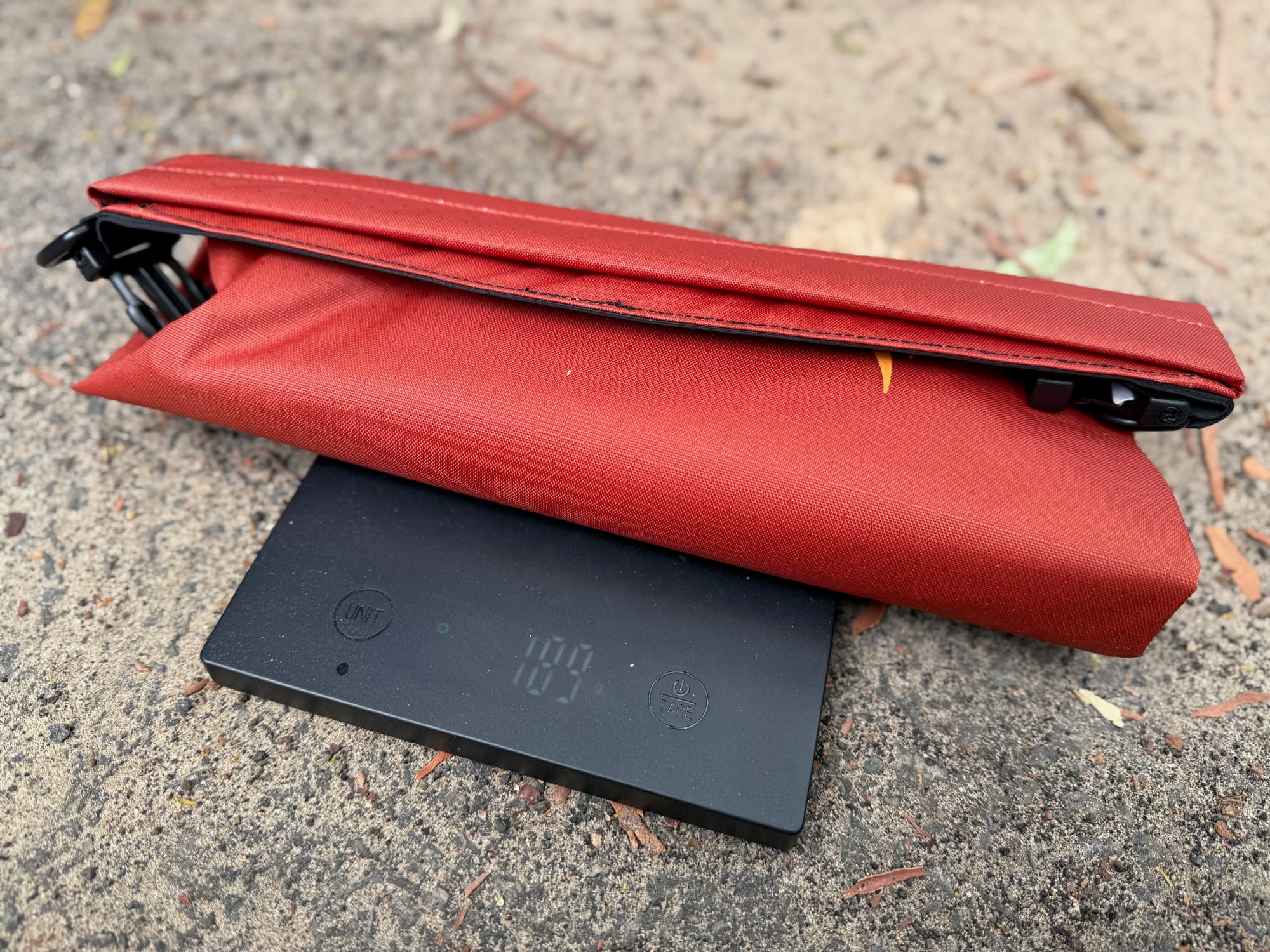The rolled-up Big River dry bag on the scale