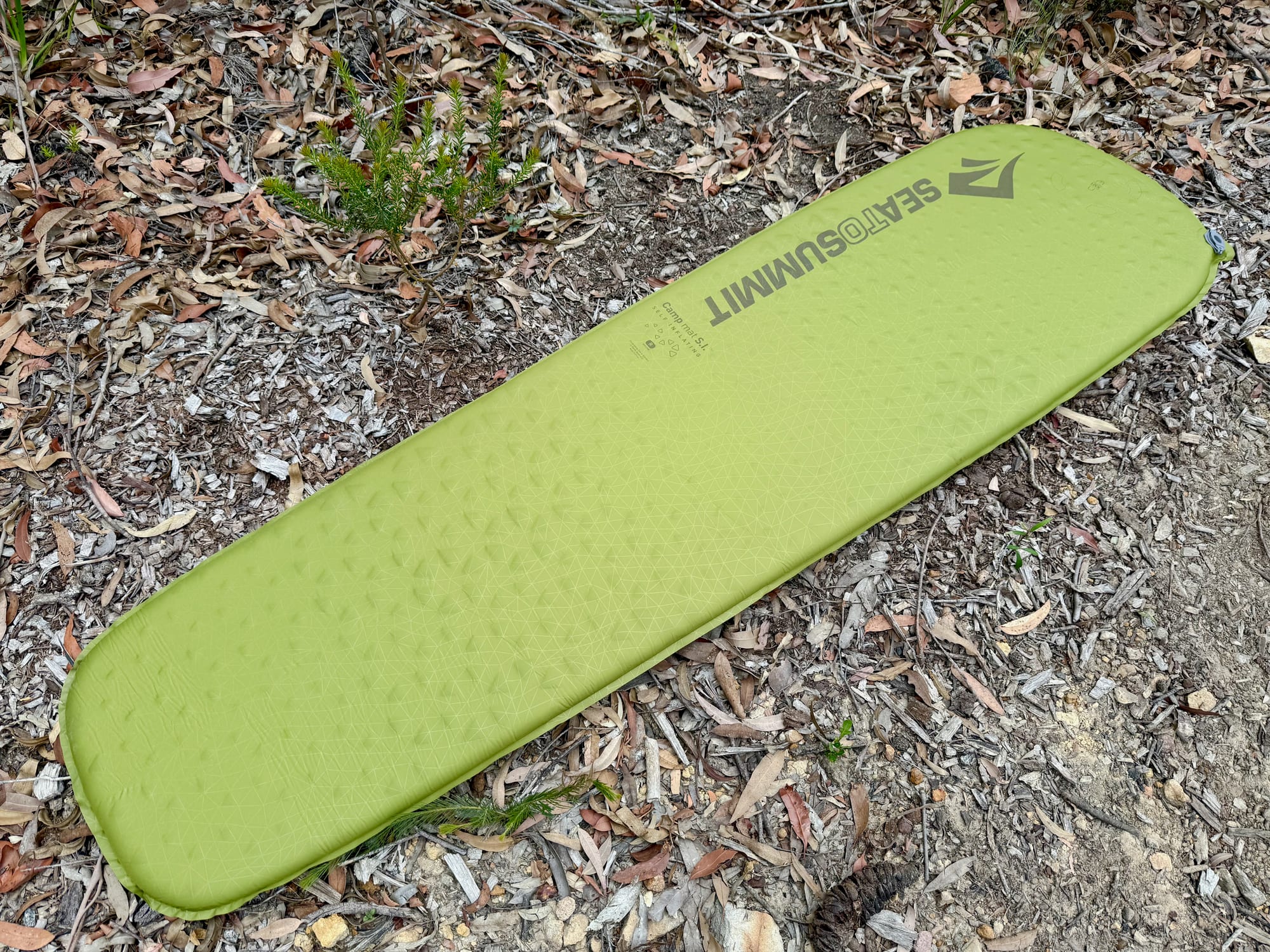 The Sea to Summit Camp Mat SI fully inflated and lying flat on the ground