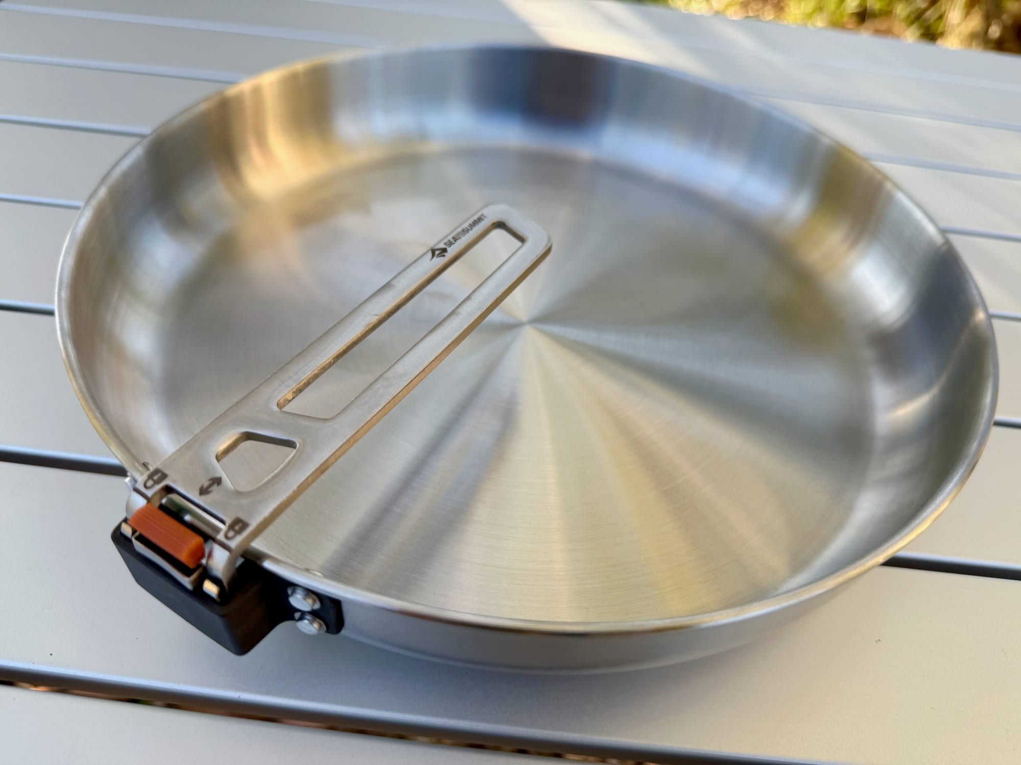 The Sea to Summit Detour Pan with its handle folded back across the pan