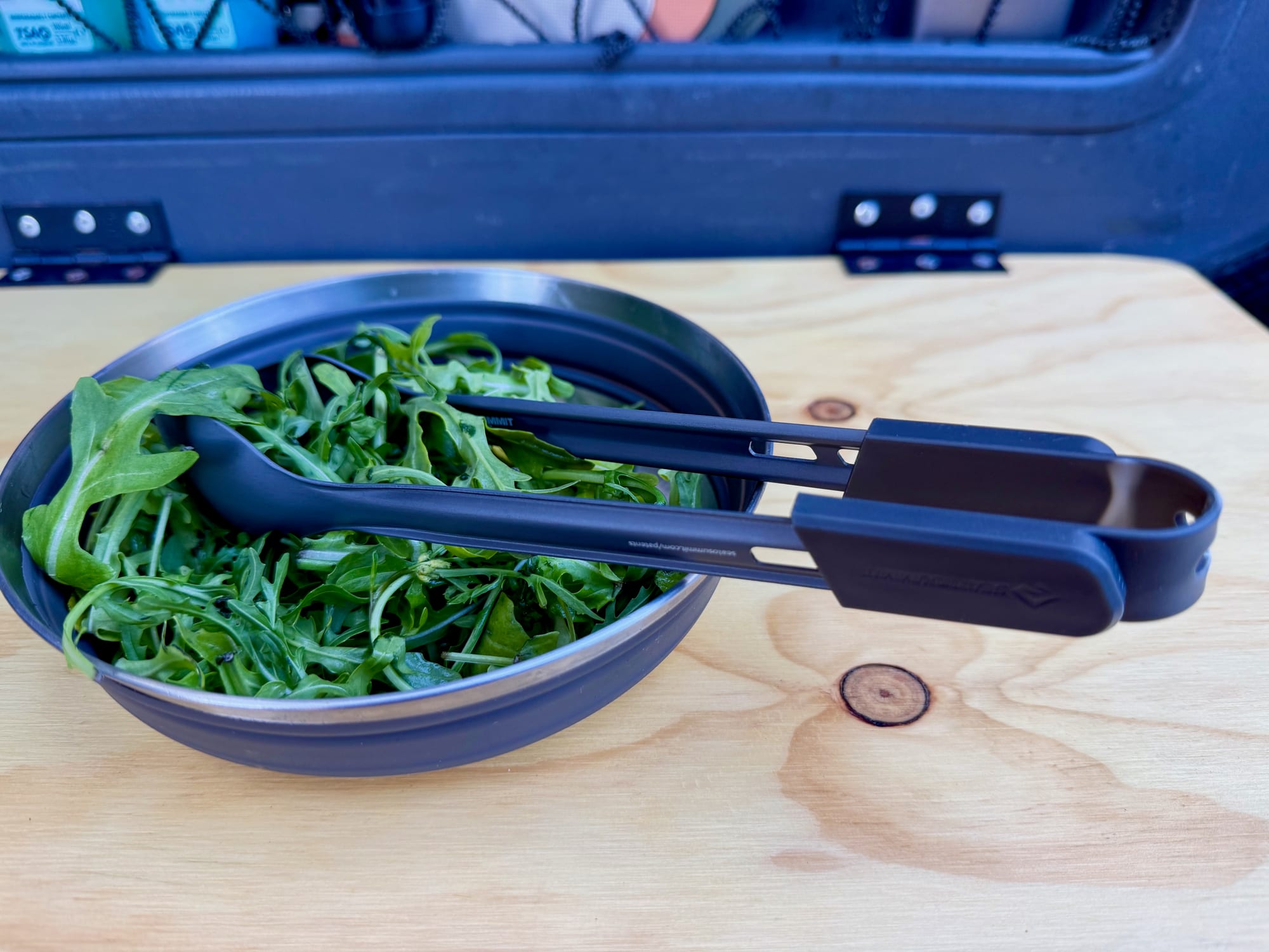 The Frontier UL spoon and spork clipped together, resting in a bowl of salad