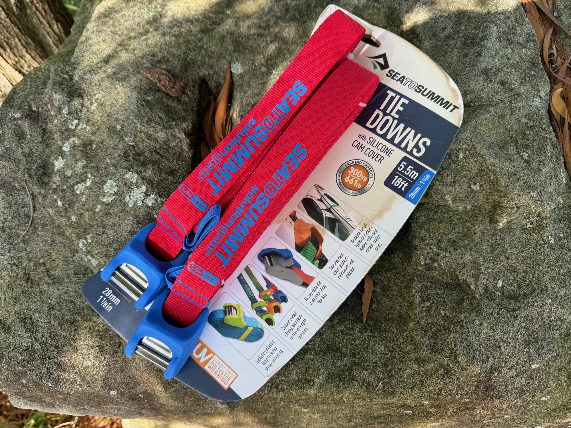 The Sea to Summit Heavy Duty Tie Downs in their pack, with the blue cam covers showing