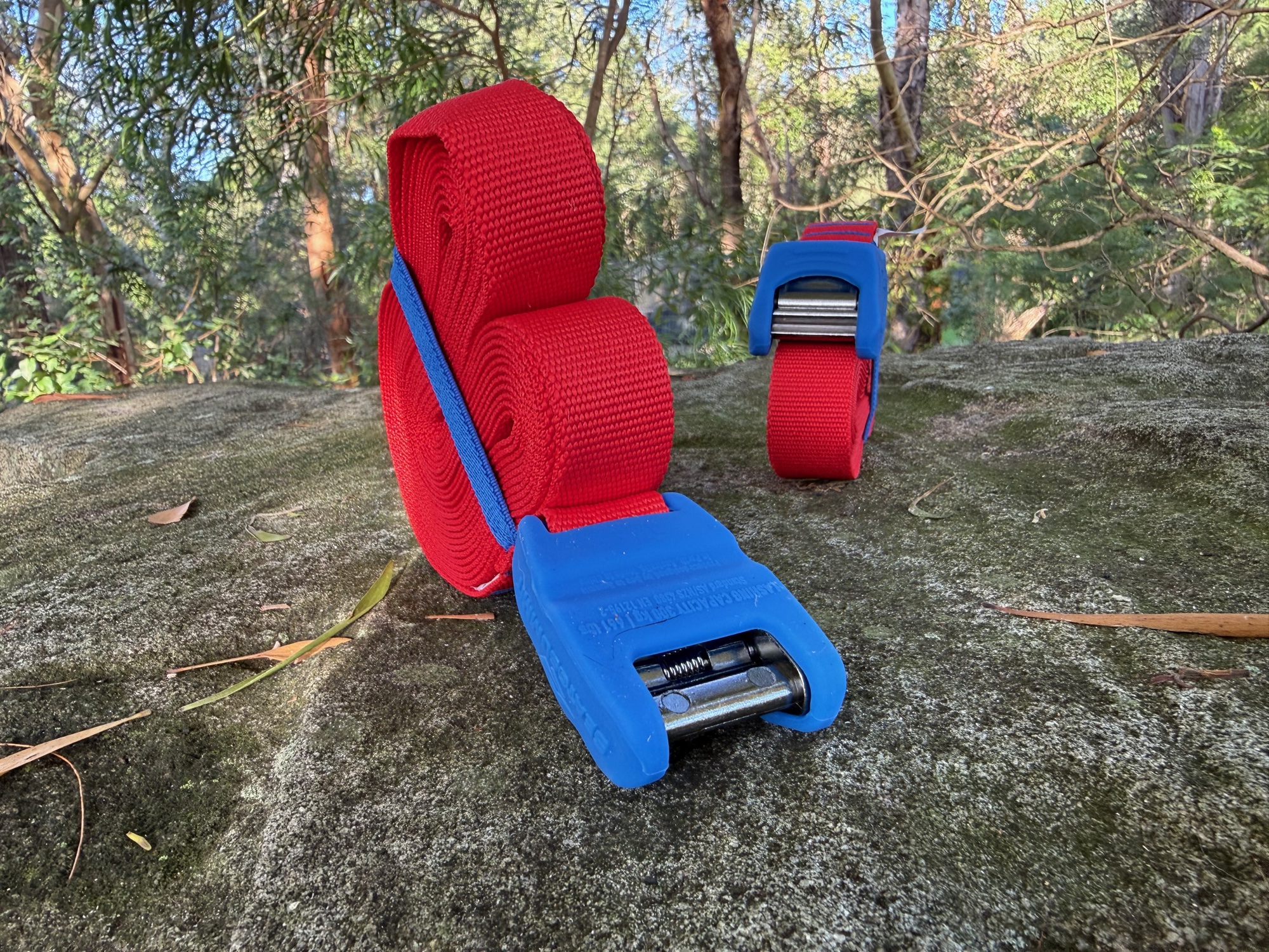 The two Sea to Summit tie downs rolled up, one standing on its end