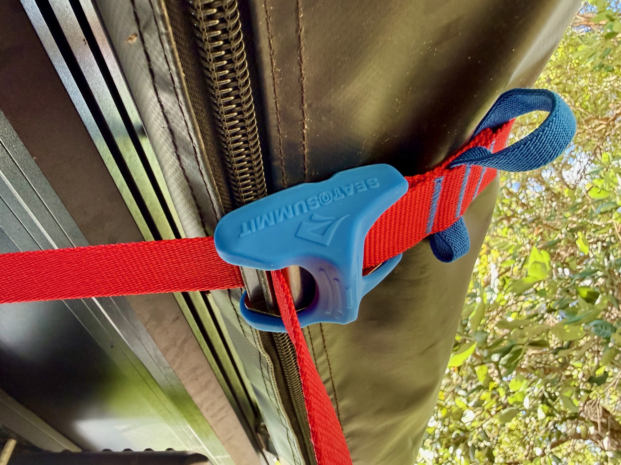 Close-up of the blue silicone cam cover on the Sea to Summit tie down