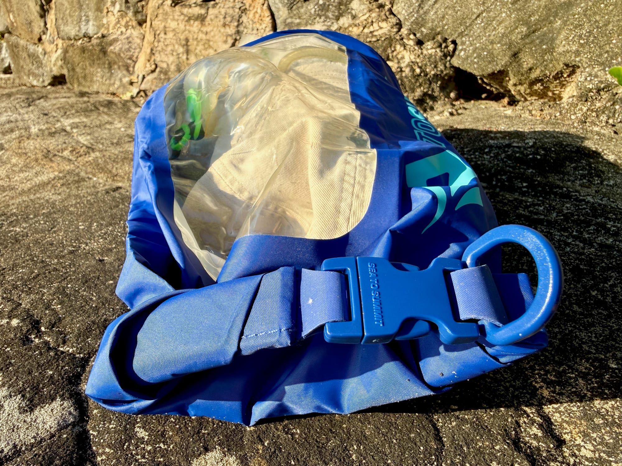 The roll top of the Dry Bag View closed with its buckle and D-ring