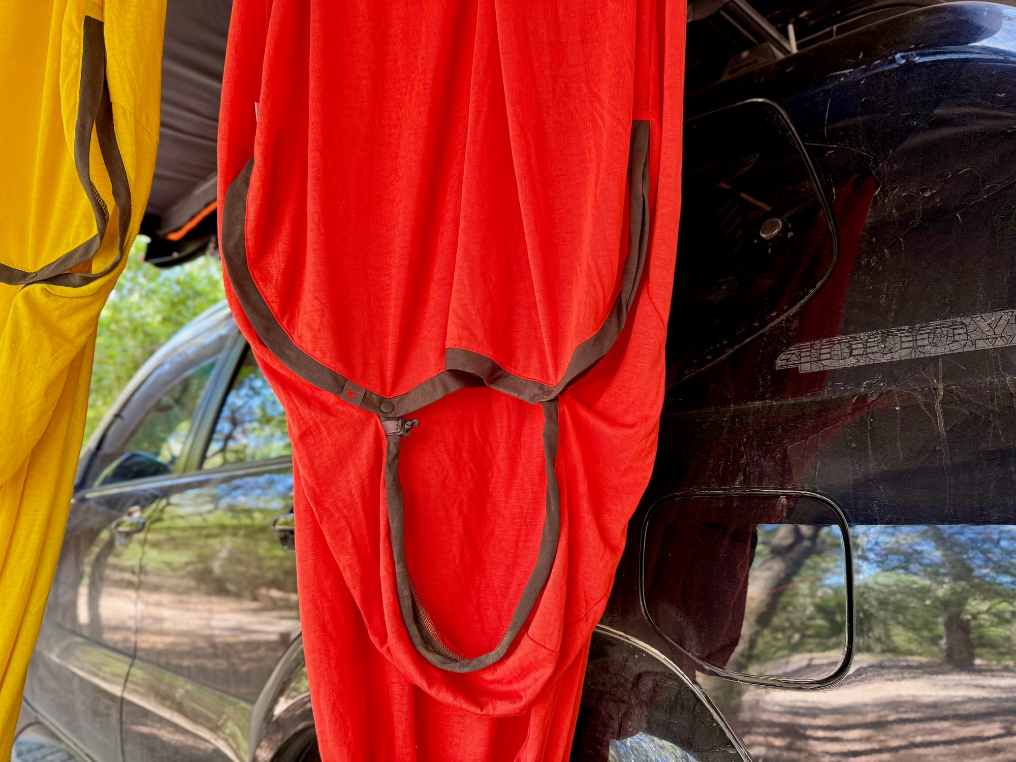 The red Reactor Extreme liner hanging under the awning, with its hood trim and drawcord