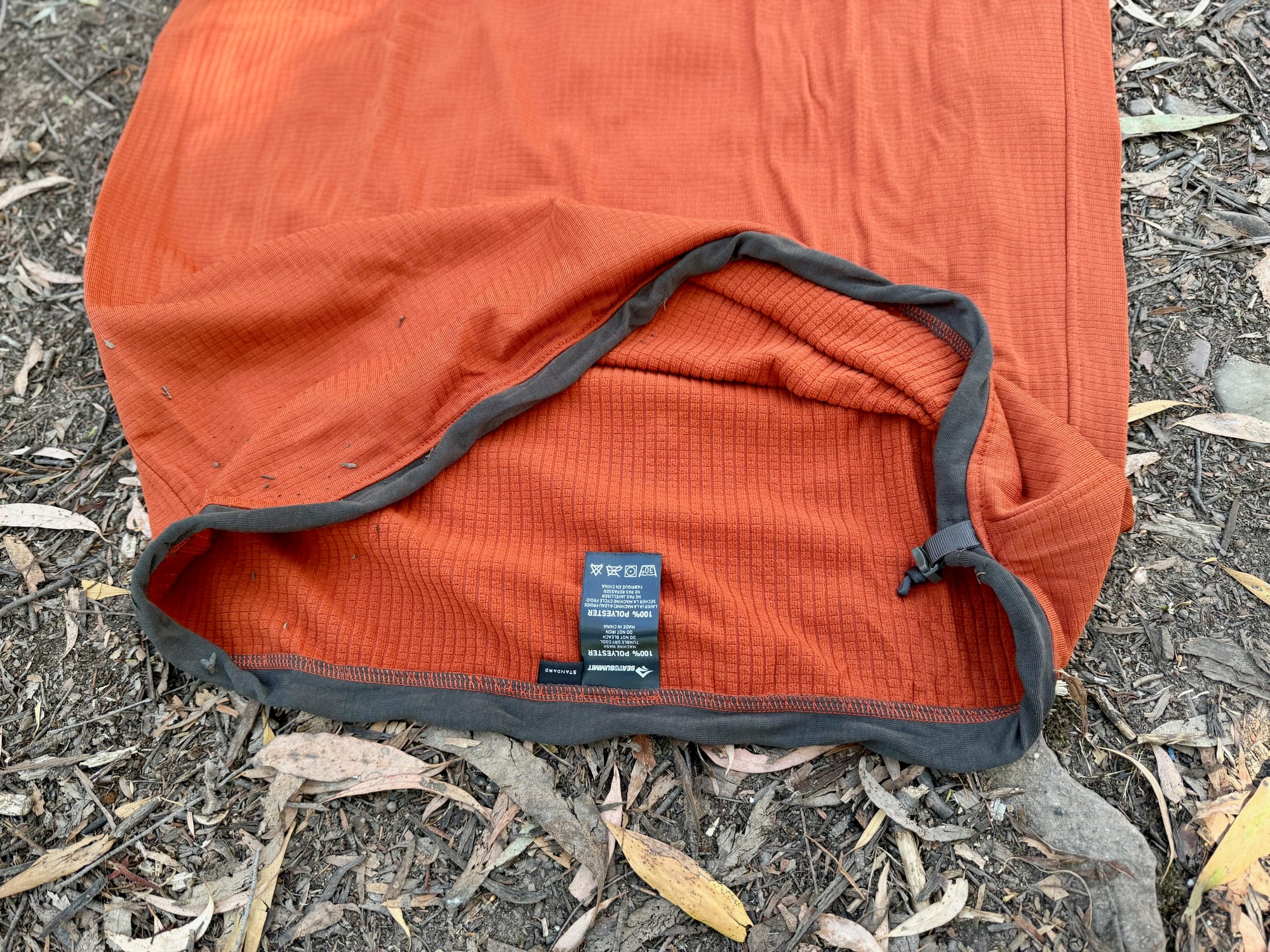 The open foot end of the Reactor Fleece liner with the drawcord in its grey trim