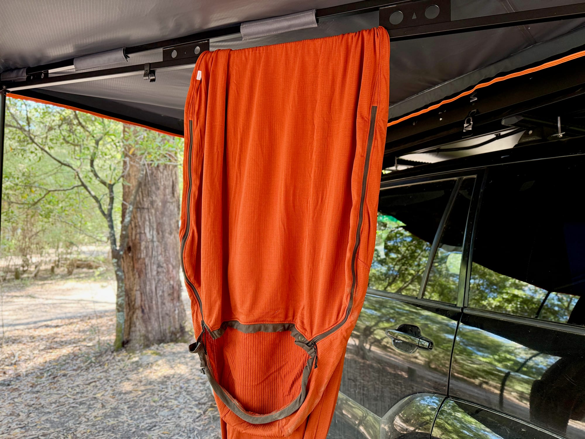The Reactor Fleece liner hanging under the awning, showing its side zip