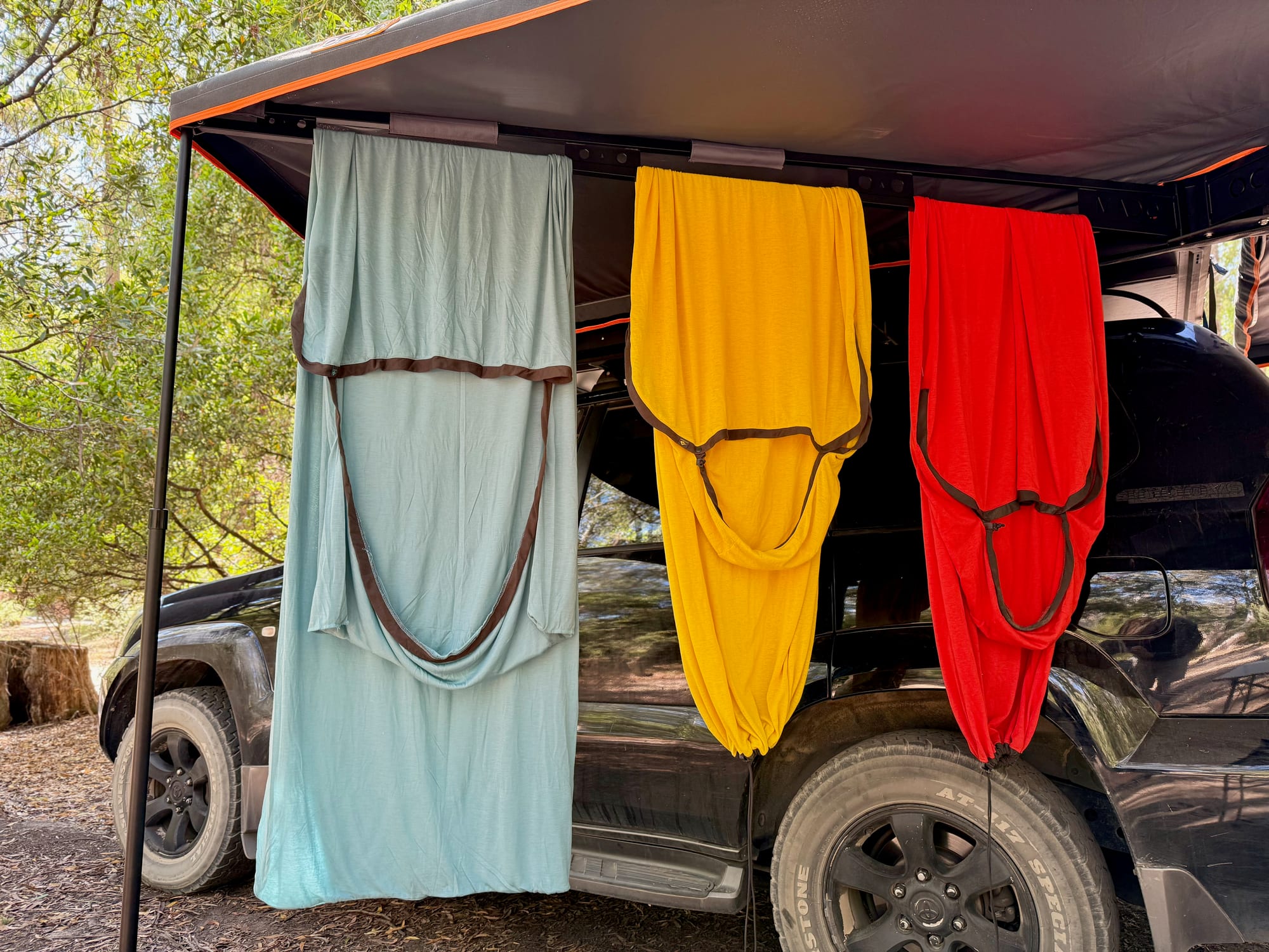 The Reactor Lightweight, Reactor Extreme and Comfort Blend liners hanging under our awning beside the Prado