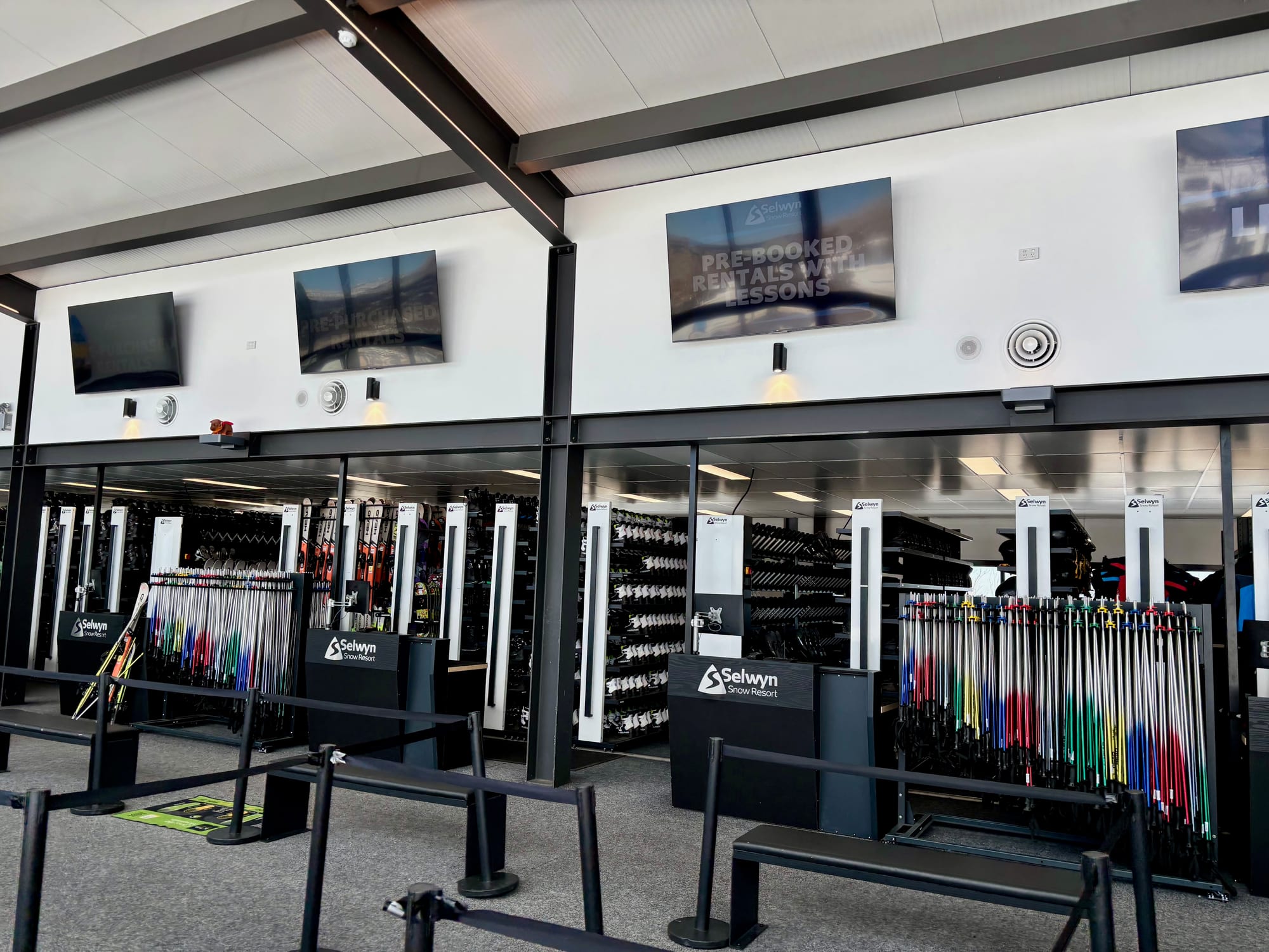 The rental area at Selwyn Snow Resort, with racks of ski poles and snow clothing