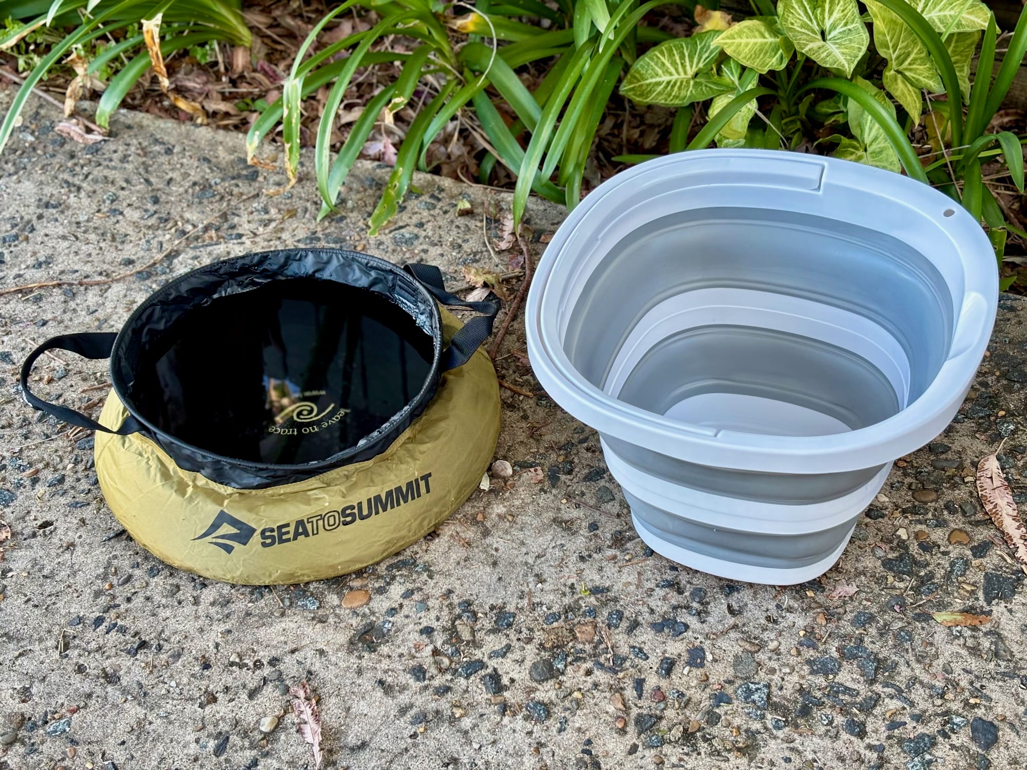 The Seymour’s bucket open next to the olive Sea to Summit folding sink