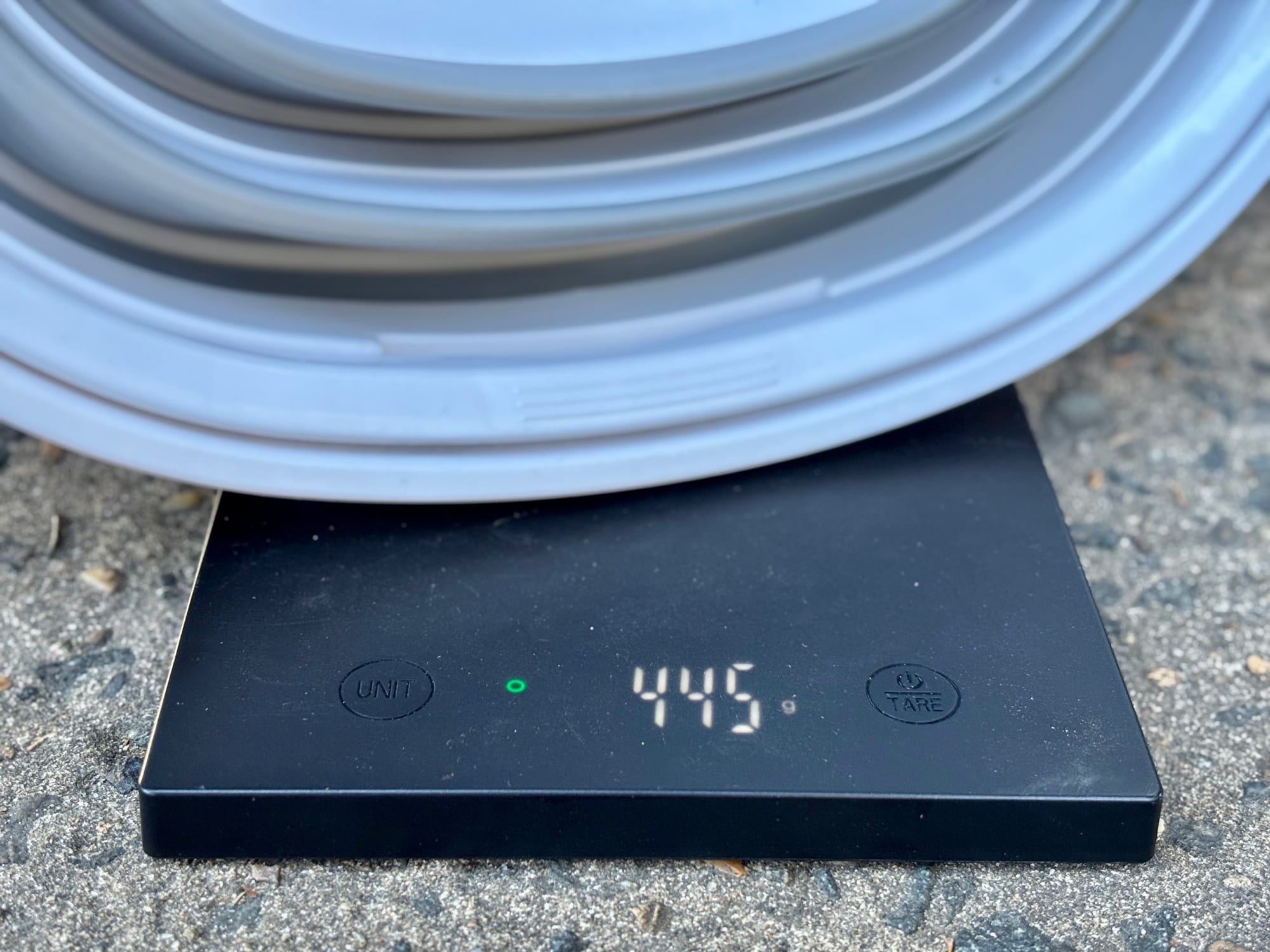 The folded Seymour’s bucket on a digital scale showing 445 grams