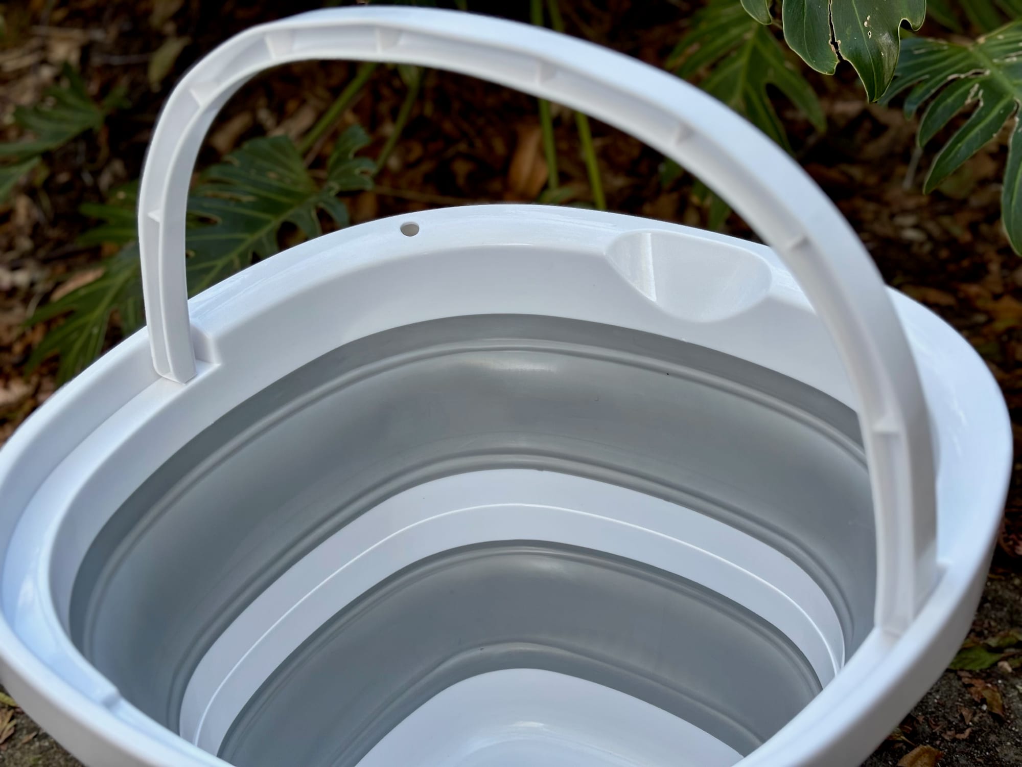 The Seymour’s bucket from above with the handle raised and the grey walls inside