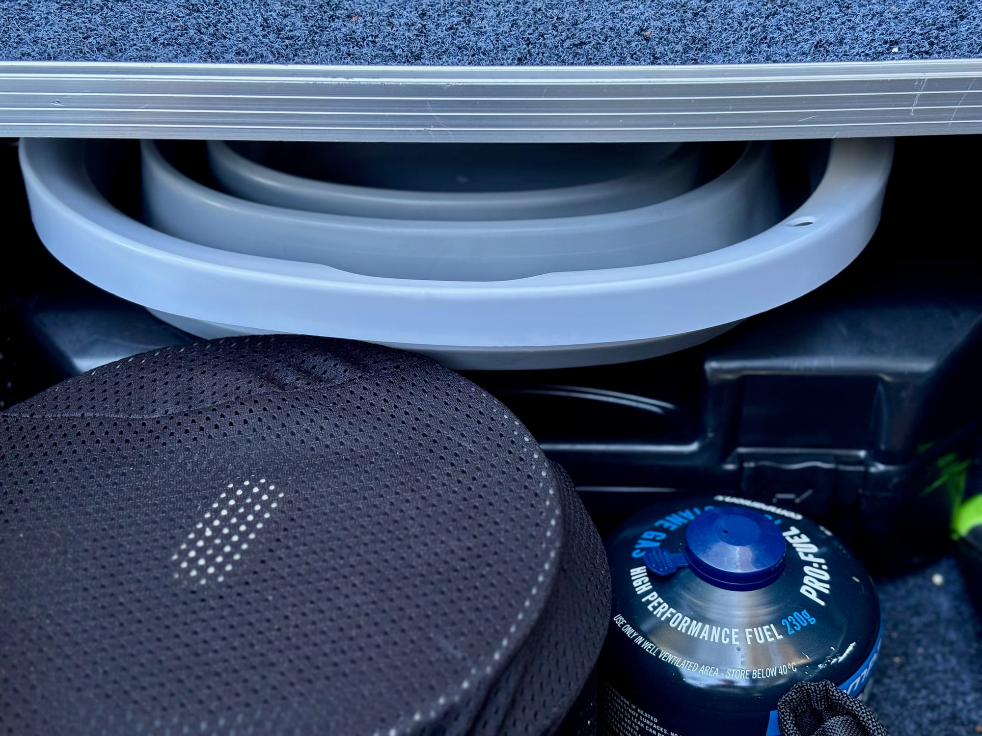 The folded bucket tucked under the drawer system in the back of the Prado