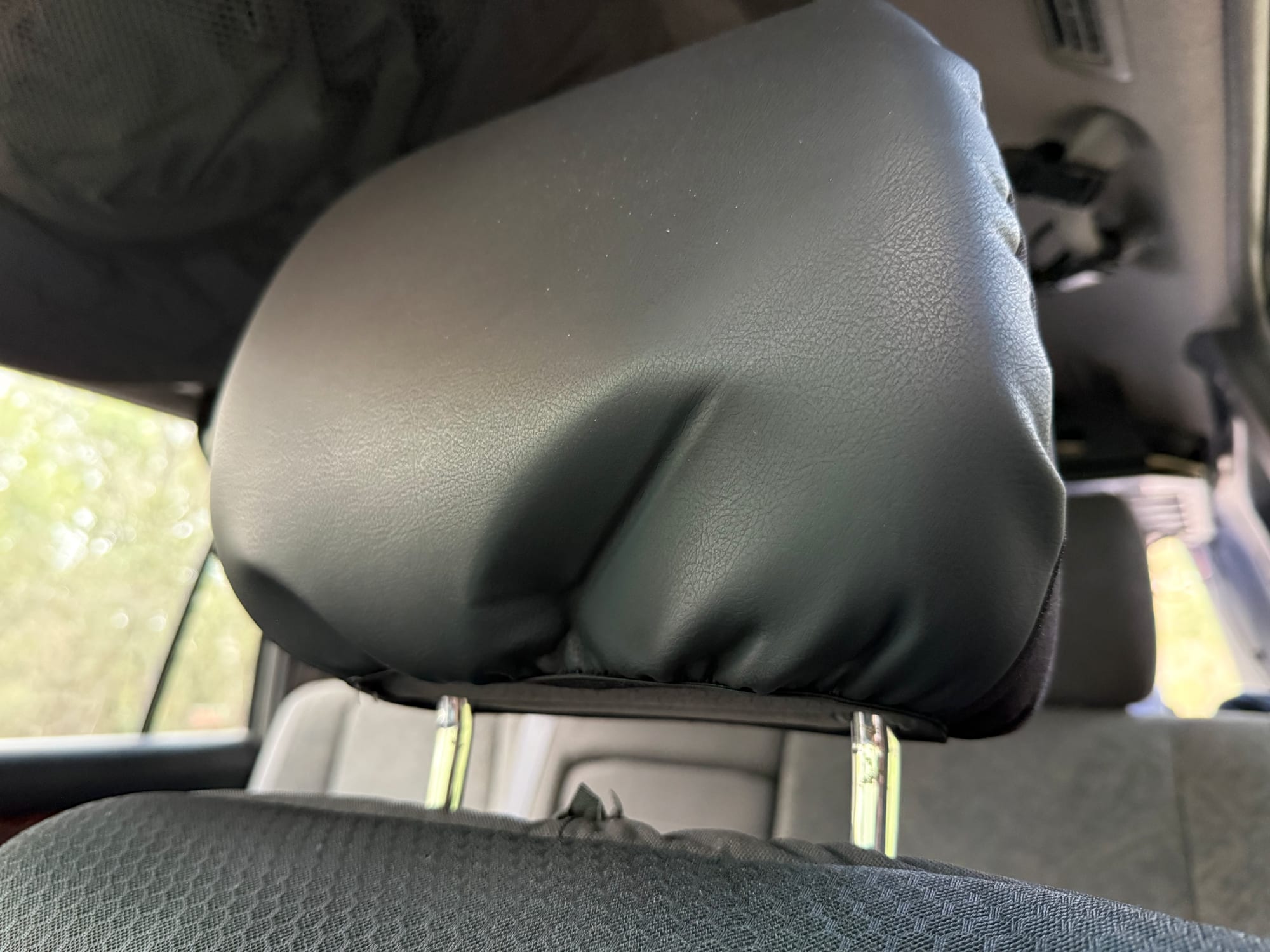 The Skechers headrest cover sitting a little loose over a 4WD headrest