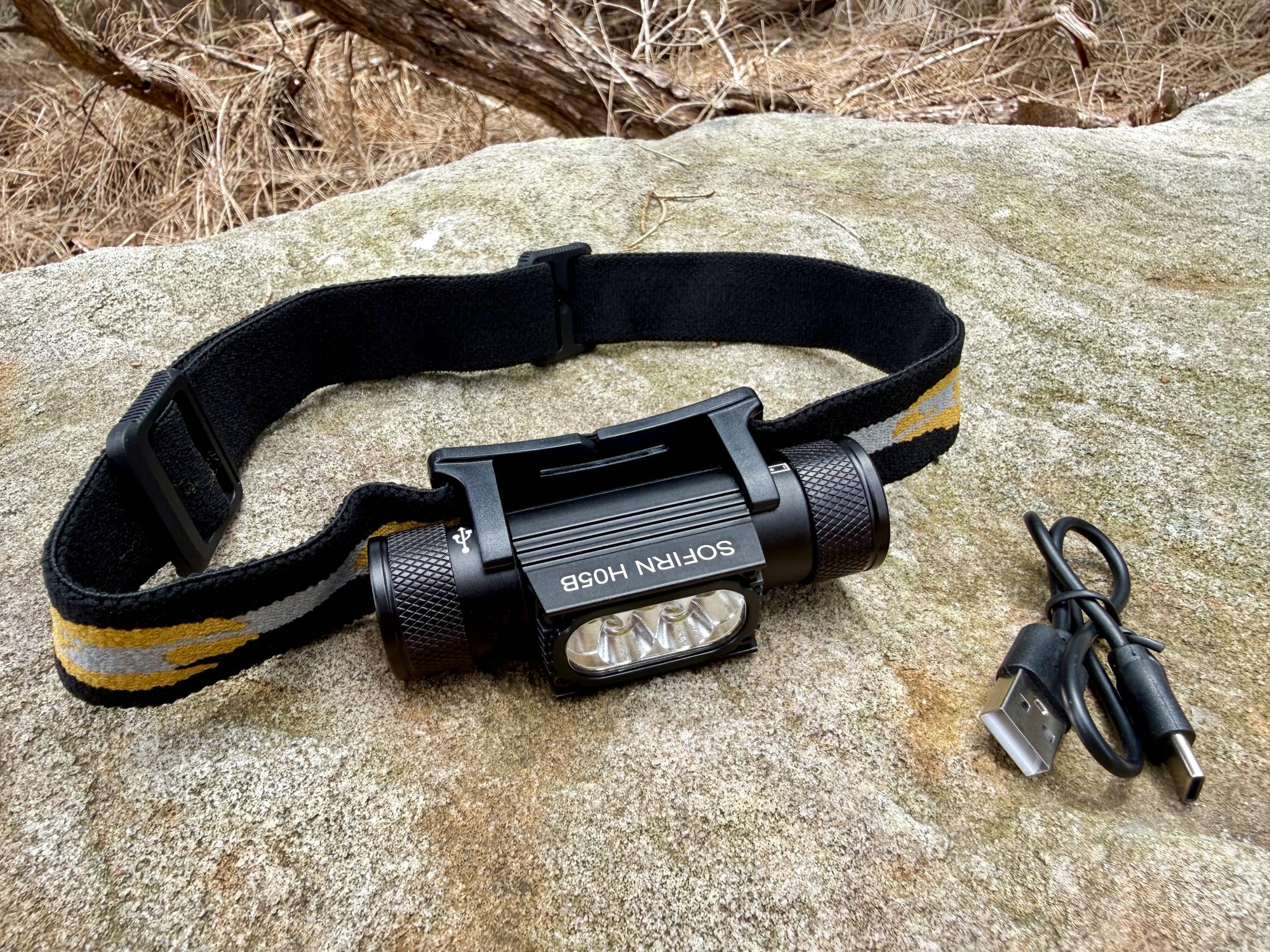 The Sofirn H05B headlamp with its headband and USB-C charging cable