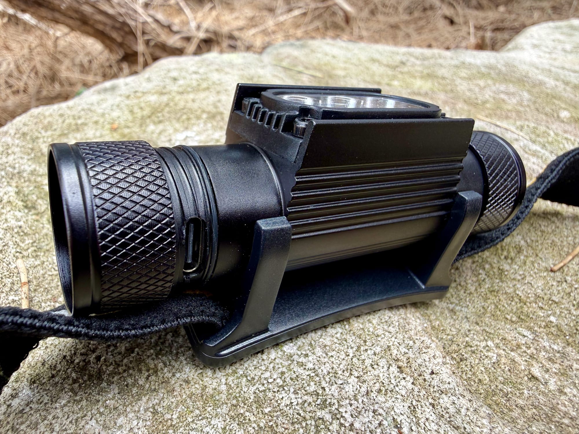 The USB-C charging port on the Sofirn H05B headlamp