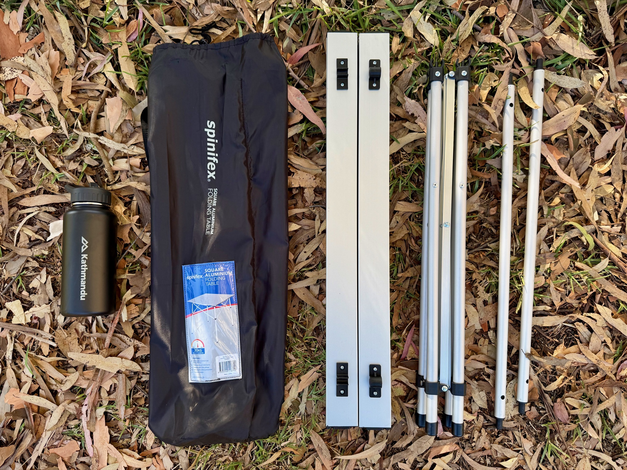 The Spinifex table’s frame, cross bars and rolled top laid out next to the bag