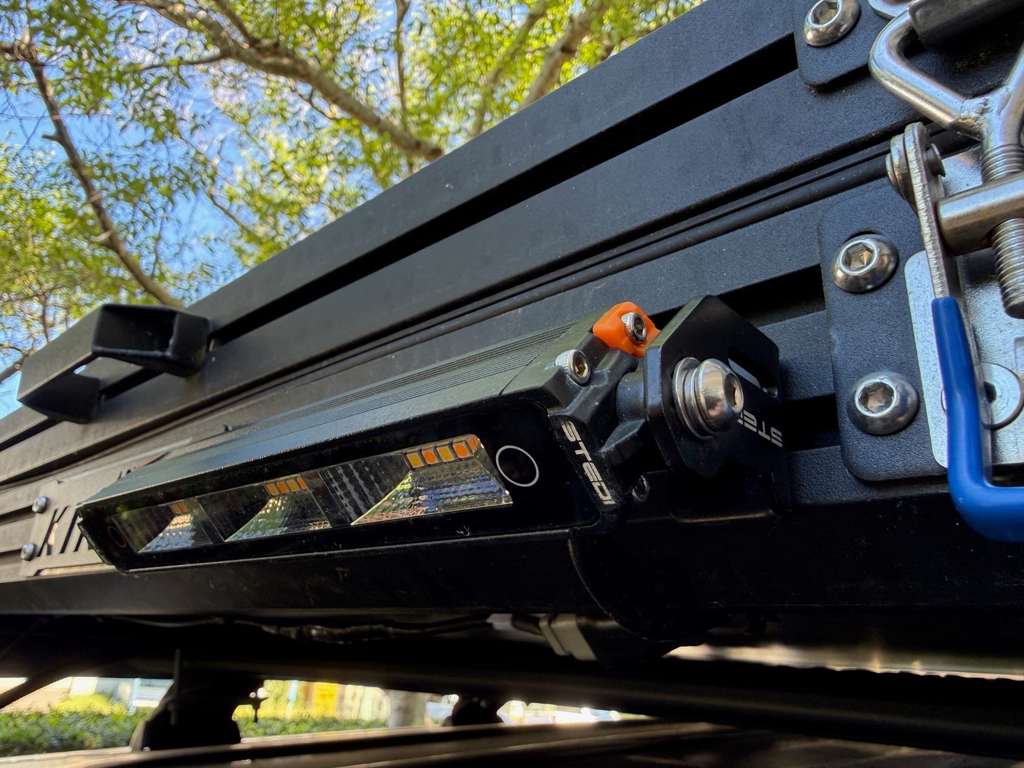 The Stedi Micro Touch on its side bracket, bolted into the channel on the side of our Kings rooftop tent